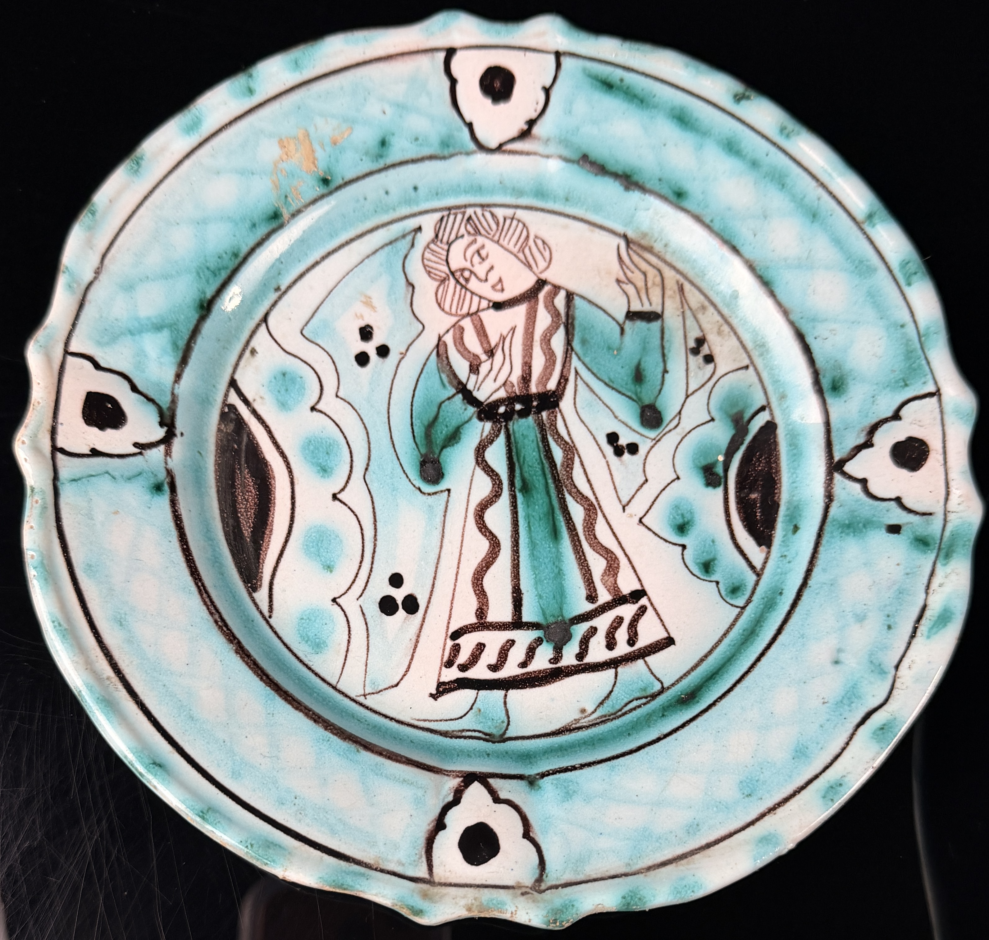 A Seven-Piece Set of Italian Hand-Painted Earthenware Plates in the Medieval Style