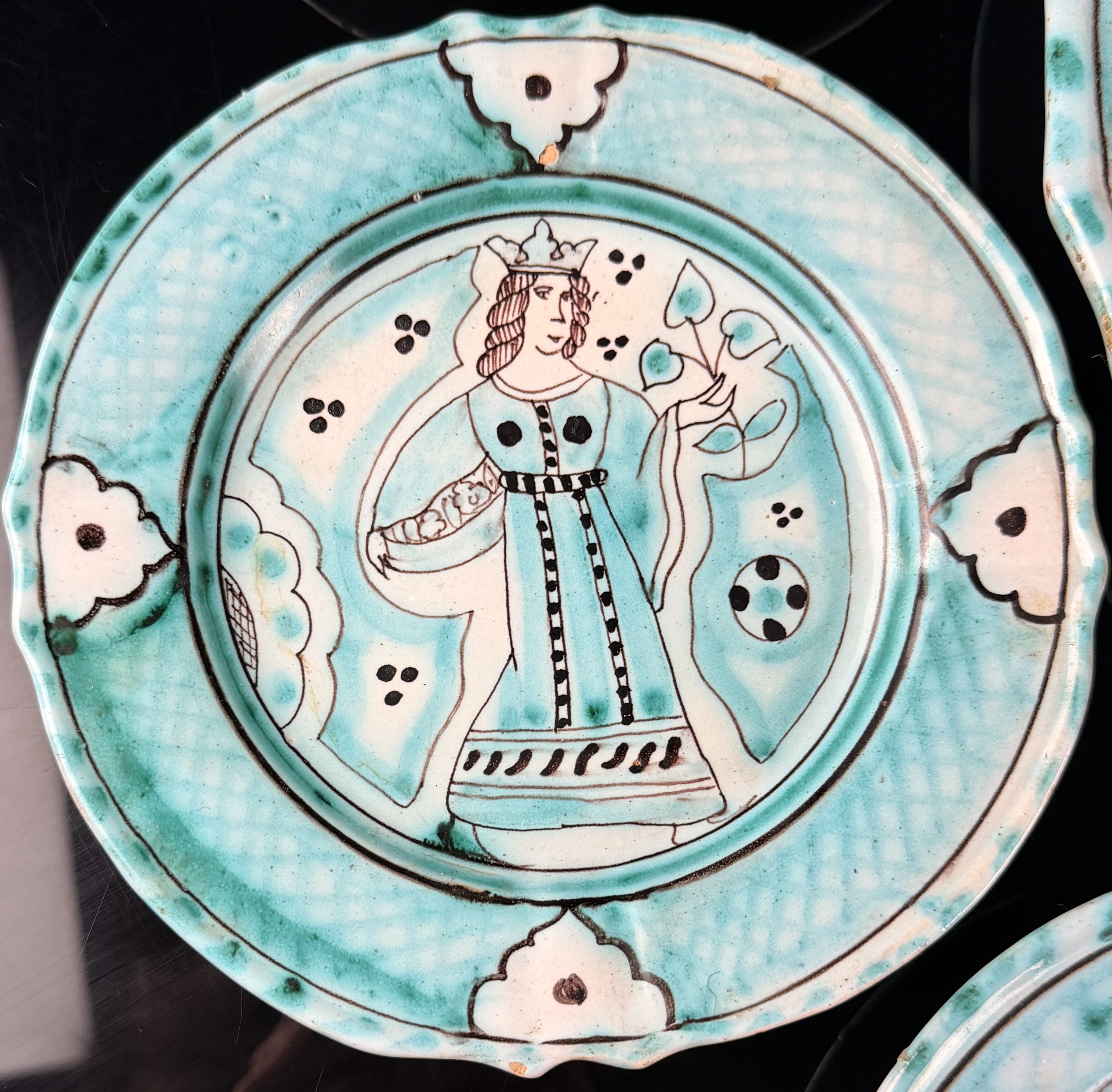 A Seven-Piece Set of Italian Hand-Painted Earthenware Plates in the Medieval Style