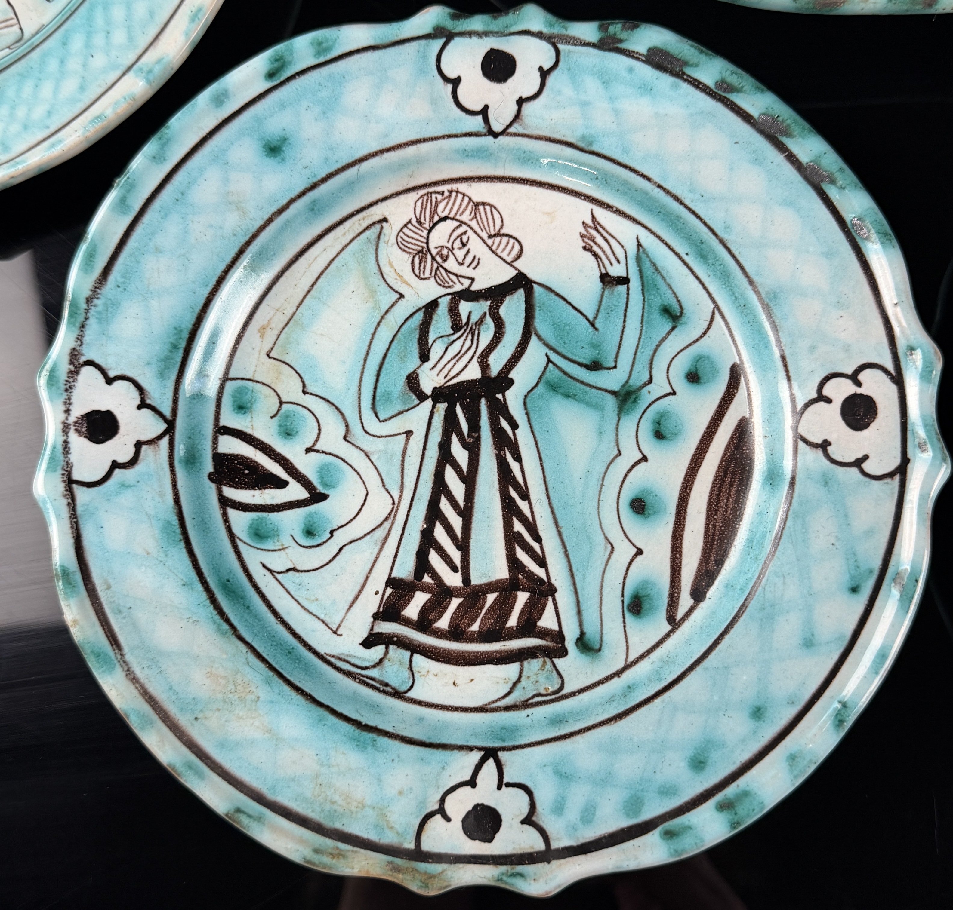 A Seven-Piece Set of Italian Hand-Painted Earthenware Plates in the Medieval Style