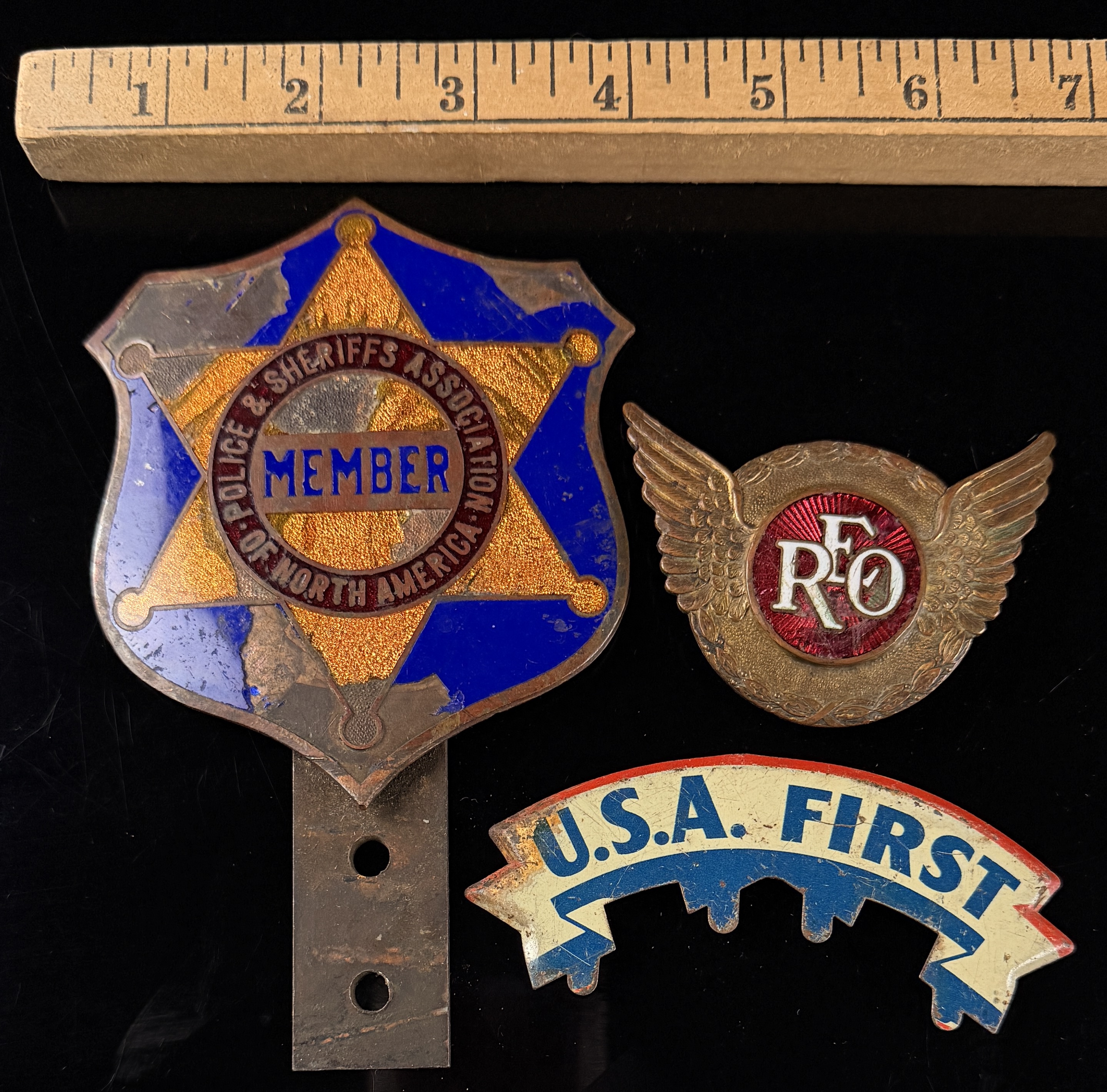 A Trio of Vintage Automotive Grille and Radiator Emblems including REO Motor Car Company
