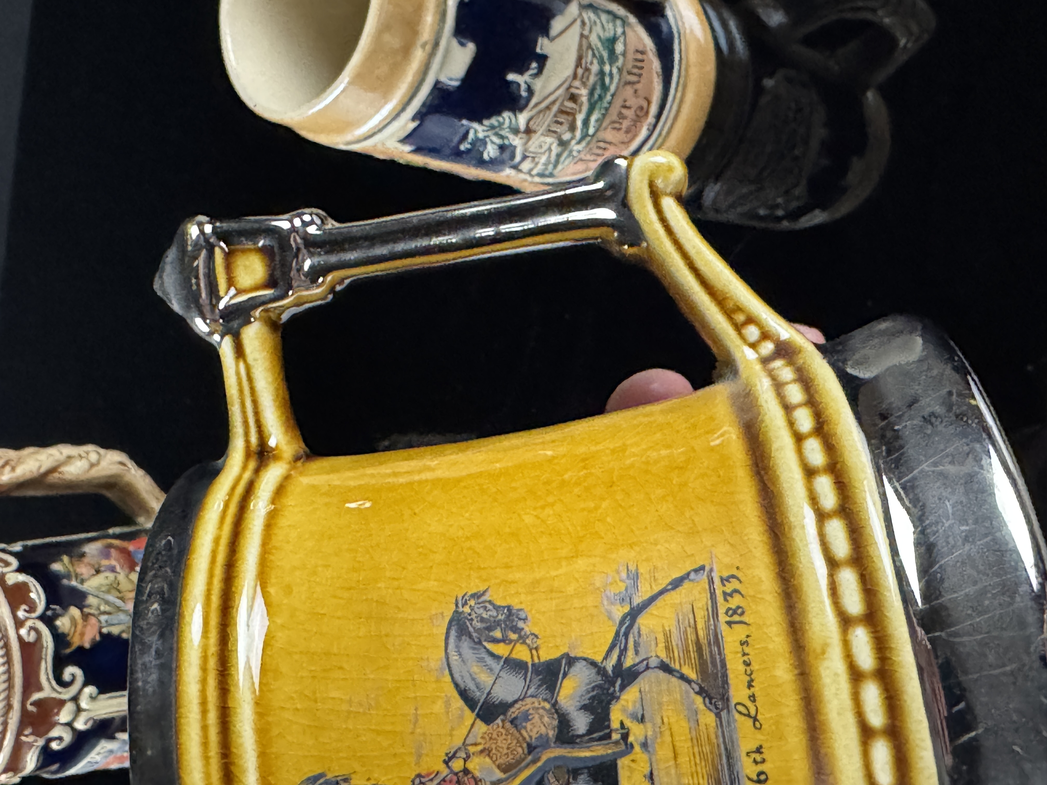 An Assortment of Four German and English Steins and Mugs