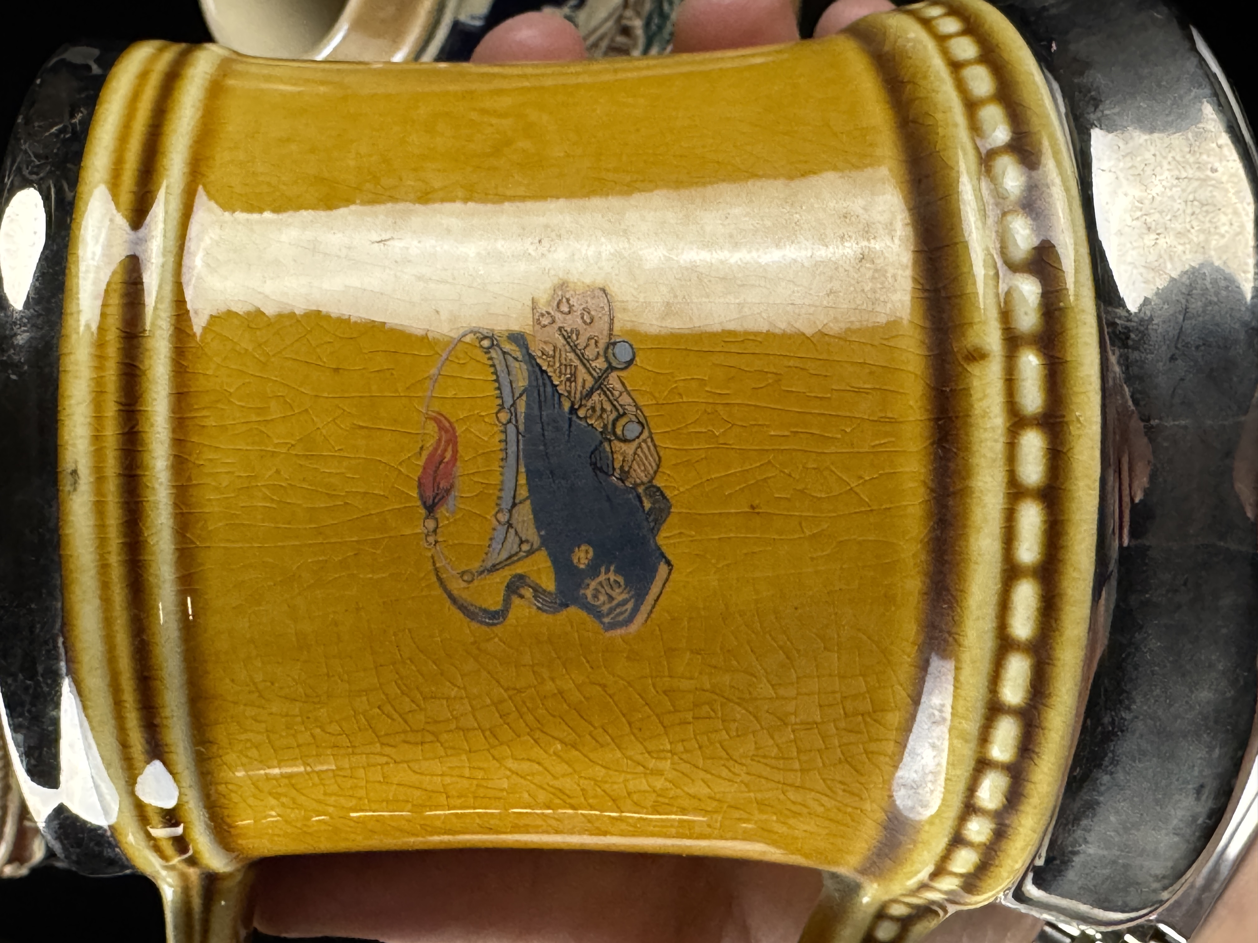 An Assortment of Four German and English Steins and Mugs
