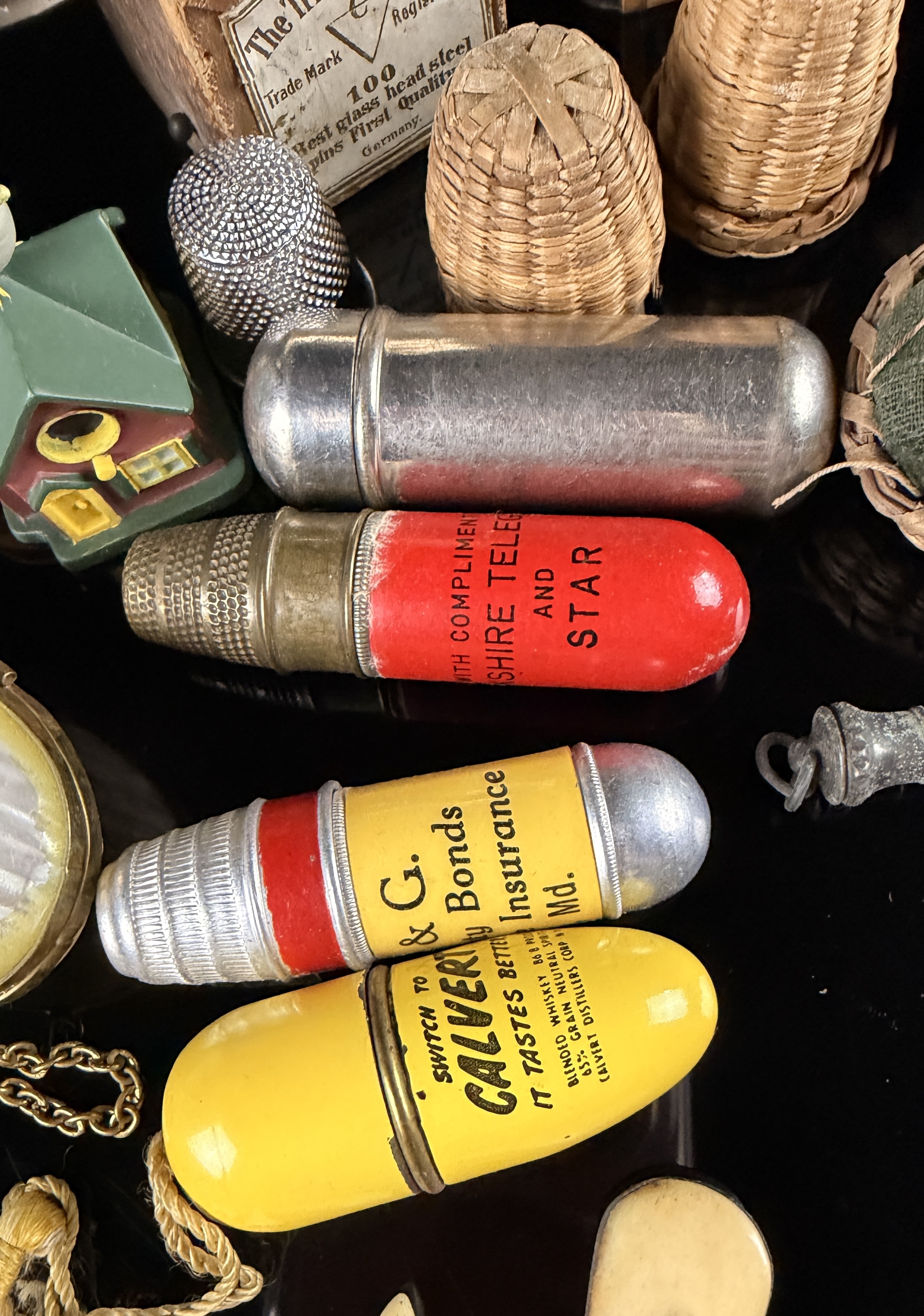 A Collection of Antique and Vintage Sewing Novelties, Tools, and Advertising Cases