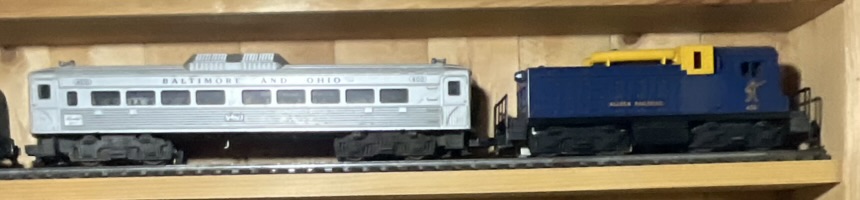 A Pair of Lionel O-Gauge Model Train Cars Including Baltimore and Ohio RDC-1 and Alaska Railroad Switcher No. 614
