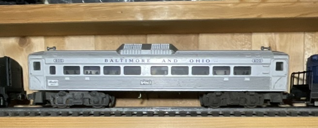 A Pair of Lionel O-Gauge Model Train Cars Including Baltimore and Ohio RDC-1 and Alaska Railroad Switcher No. 614