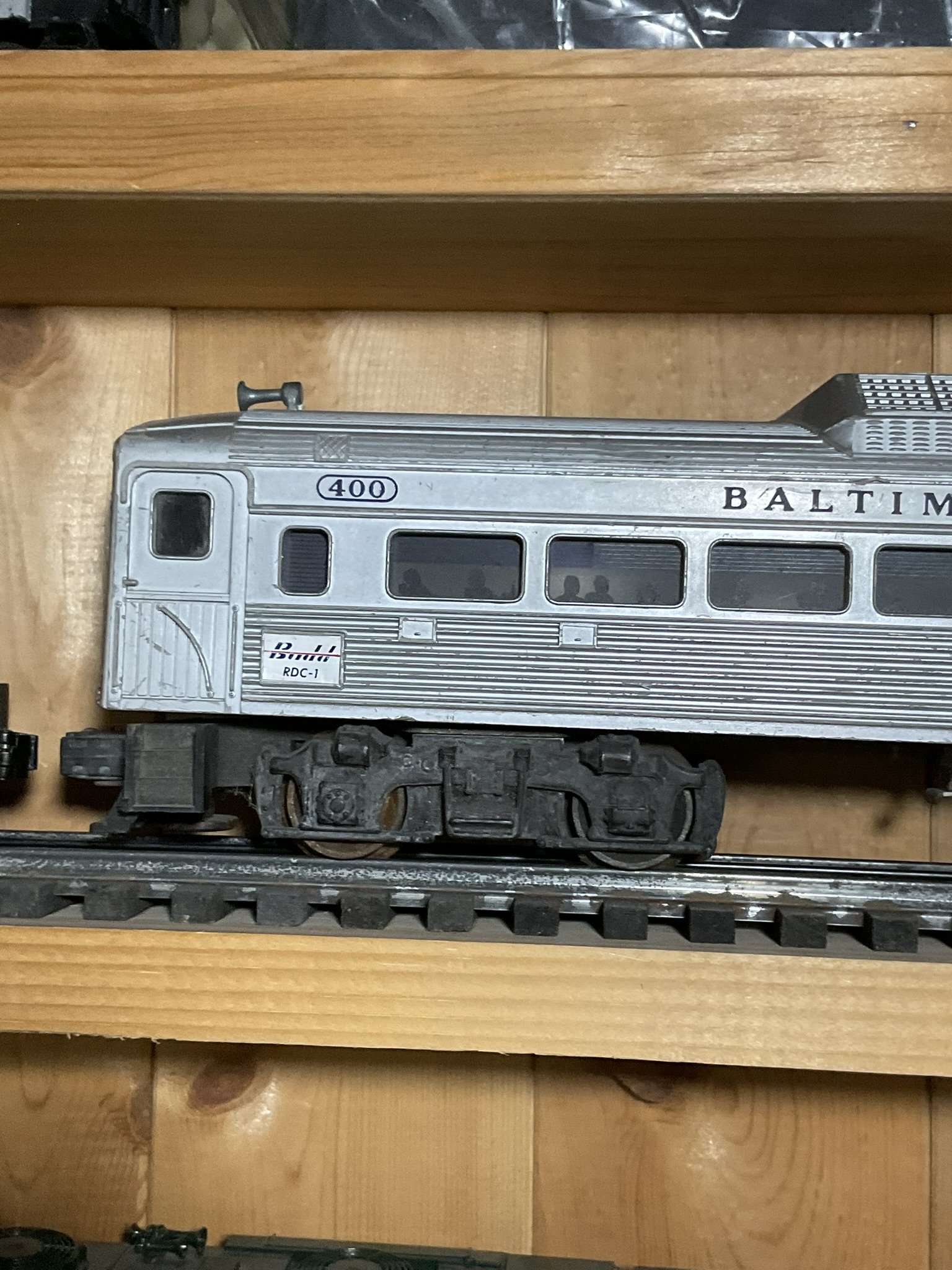 A Pair of Lionel O-Gauge Model Train Cars Including Baltimore and Ohio RDC-1 and Alaska Railroad Switcher No. 614