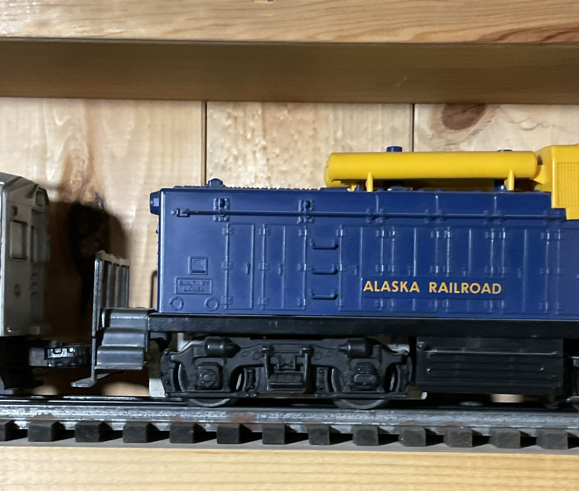 A Pair of Lionel O-Gauge Model Train Cars Including Baltimore and Ohio RDC-1 and Alaska Railroad Switcher No. 614