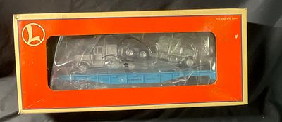 Lionel 6-36091 Maersk Flatcar with Two Tractors. This Lionel O-gauge rolling stock is a Maersk 