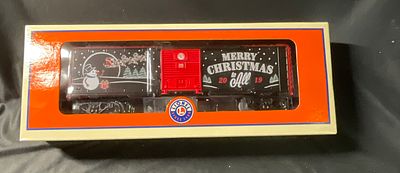 Lionel O-Gauge 2019 Christmas Boxcar 1928490. This Lionel L.L.C. O-gauge model train boxcar is 