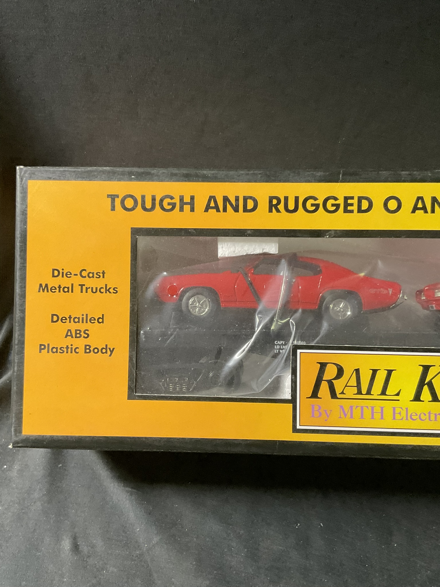 RailKing by MTH Electric Trains Item 30-7639 Auto Transportation Flatcar with Two Ertl 1968 Pontiac GTOs