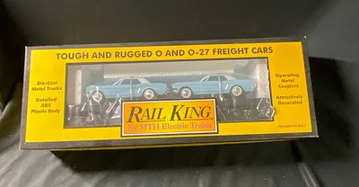 MTH Rail King 30-7617 O-Gauge Auto Transport Flat Car with Ertl 64 Mustangs. This is an O-gauge 