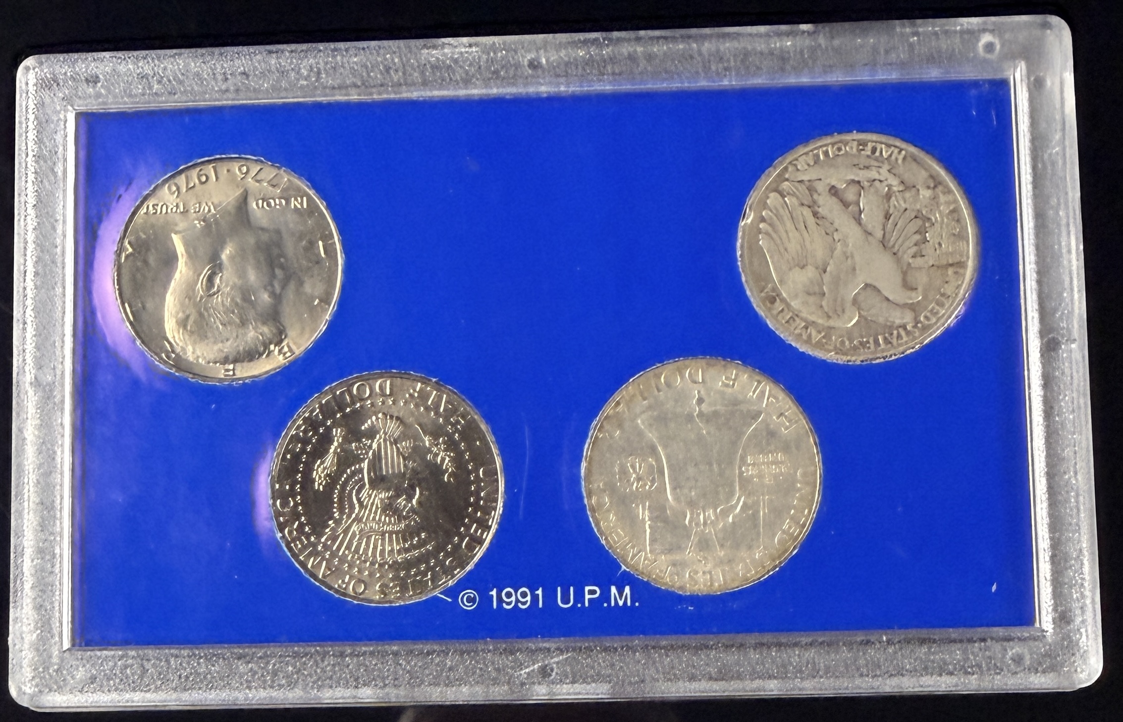 A Set of Four US Half Dollar Coins, Americana Series Vanishing Classics Collection