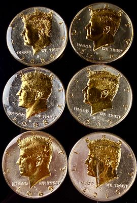 A Collection of US Danbury Mint Gold-Plated Kennedy Half Dollars. This collection of US Kennedy 