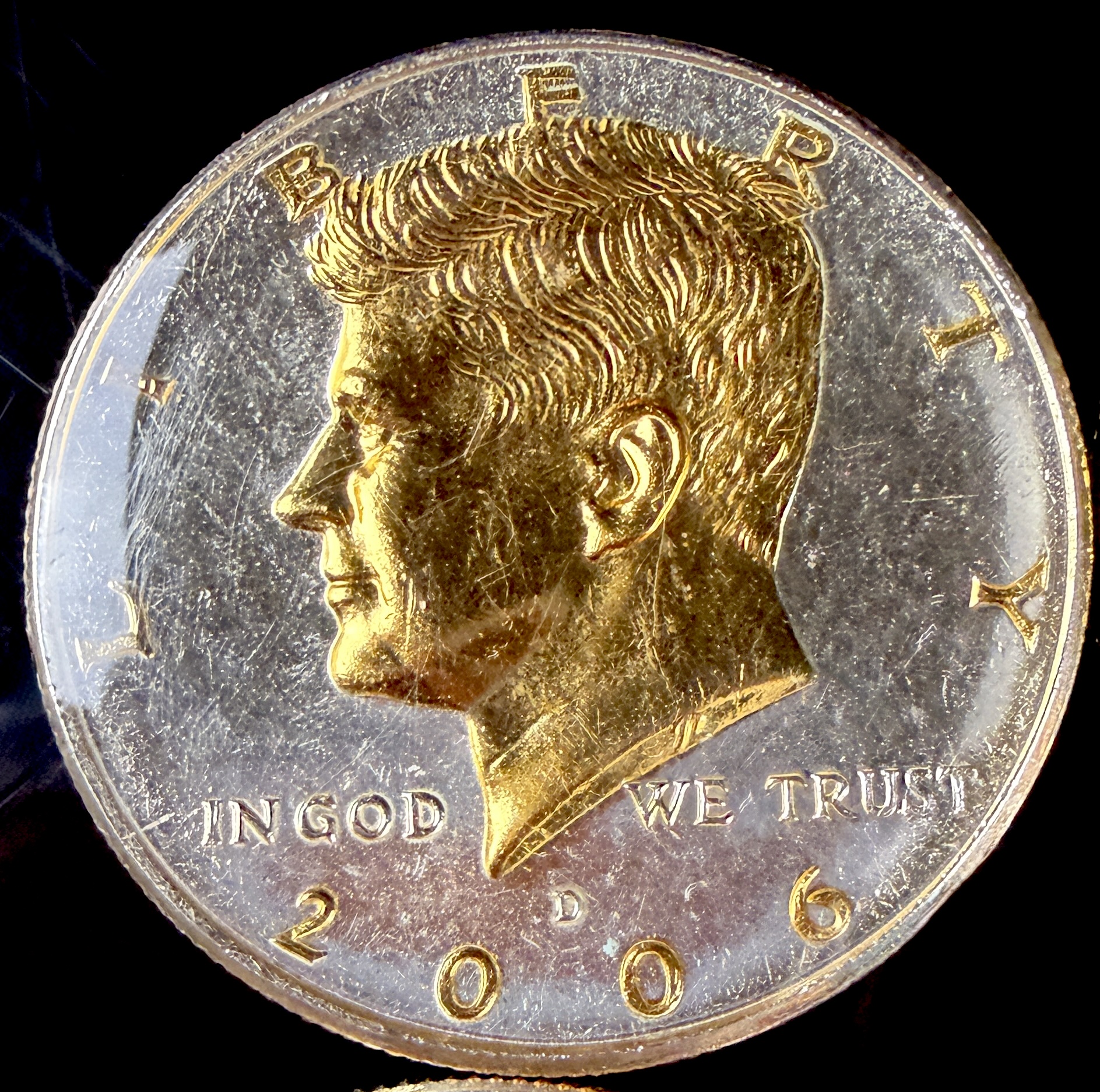A Collection of US Danbury Mint Gold-Plated Kennedy Half Dollars