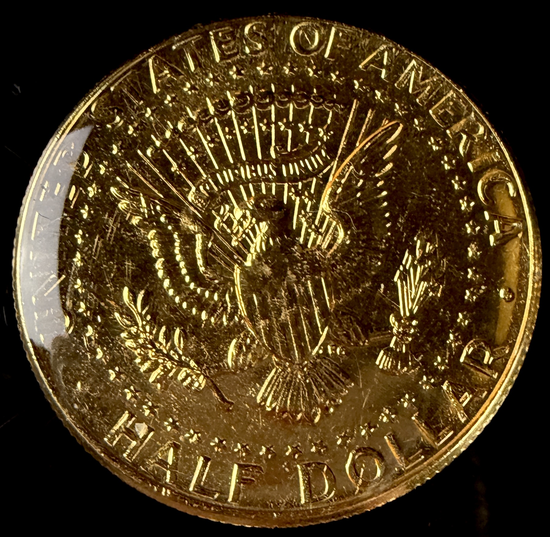 A Collection of US Danbury Mint Gold-Plated Kennedy Half Dollars