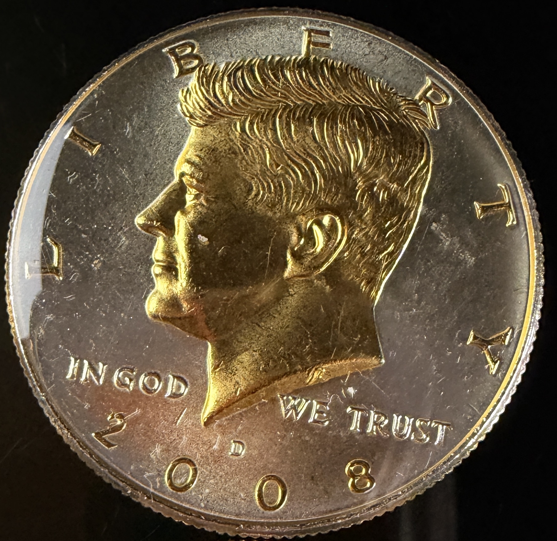 A Collection of US Danbury Mint Gold-Plated Kennedy Half Dollars