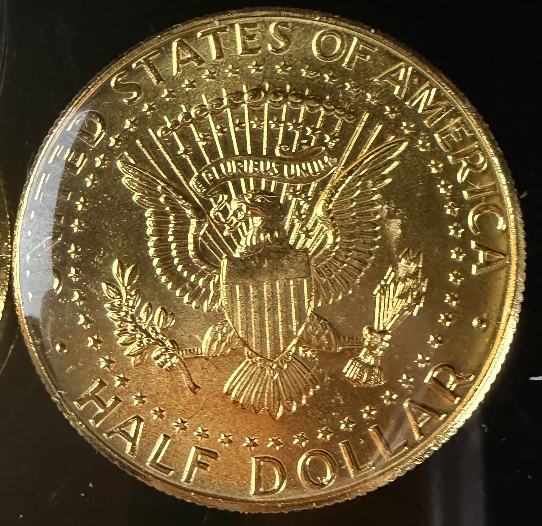 A Collection of US Danbury Mint Gold-Plated Kennedy Half Dollars