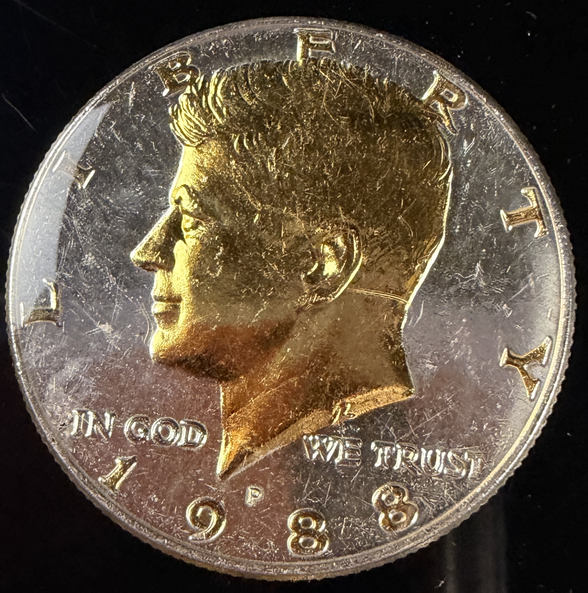A Collection of US Danbury Mint Gold-Plated Kennedy Half Dollars