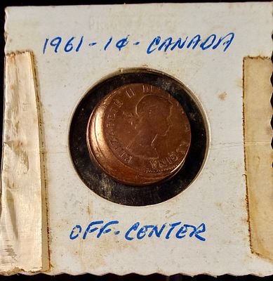 Canada 1961 1 Cent Bronze Coin Off-Center Strike Error. A 1961 Canadian one-cent bronze coin 
