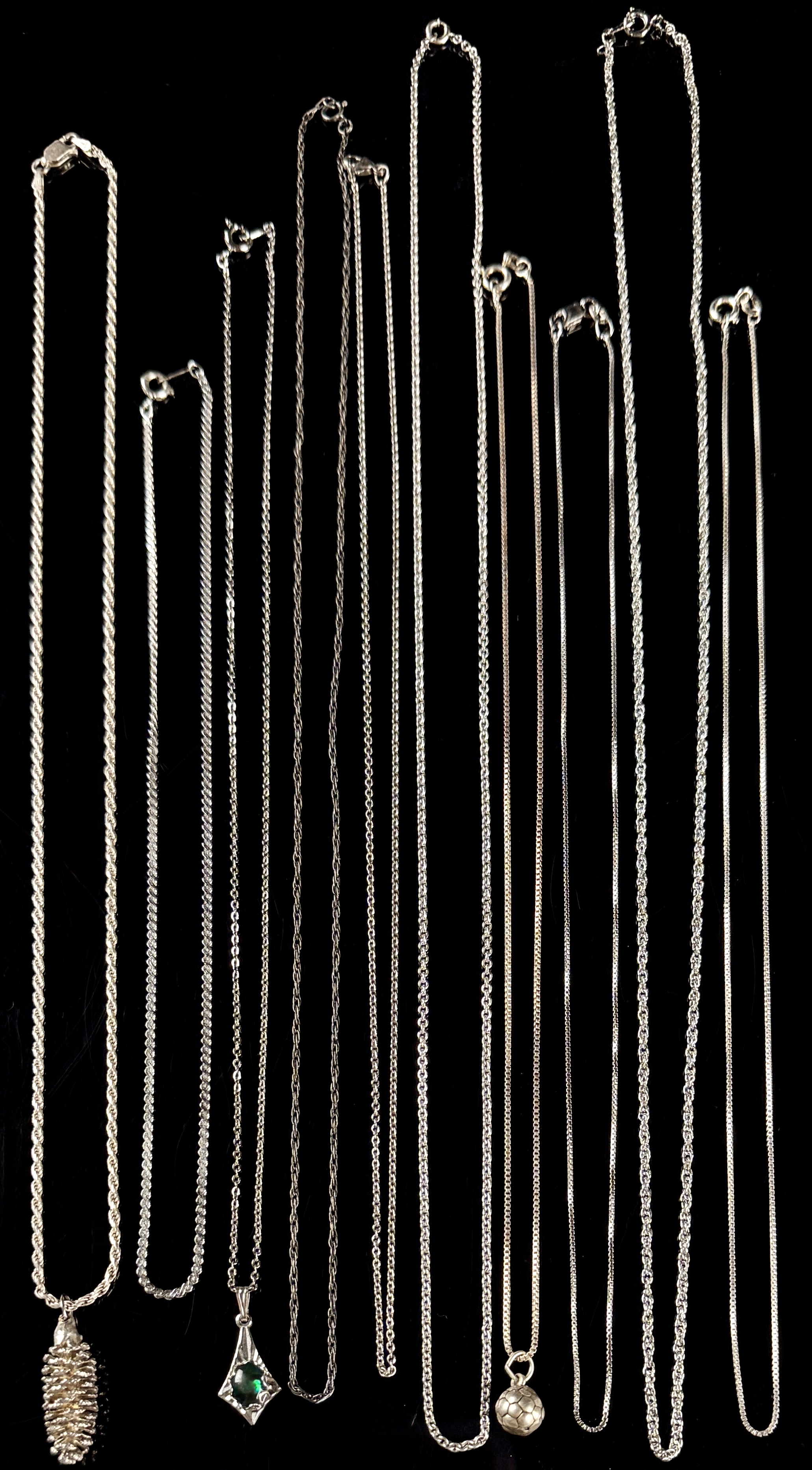 An Assortment of Eleven Sterling Silver Necklaces and Pendants