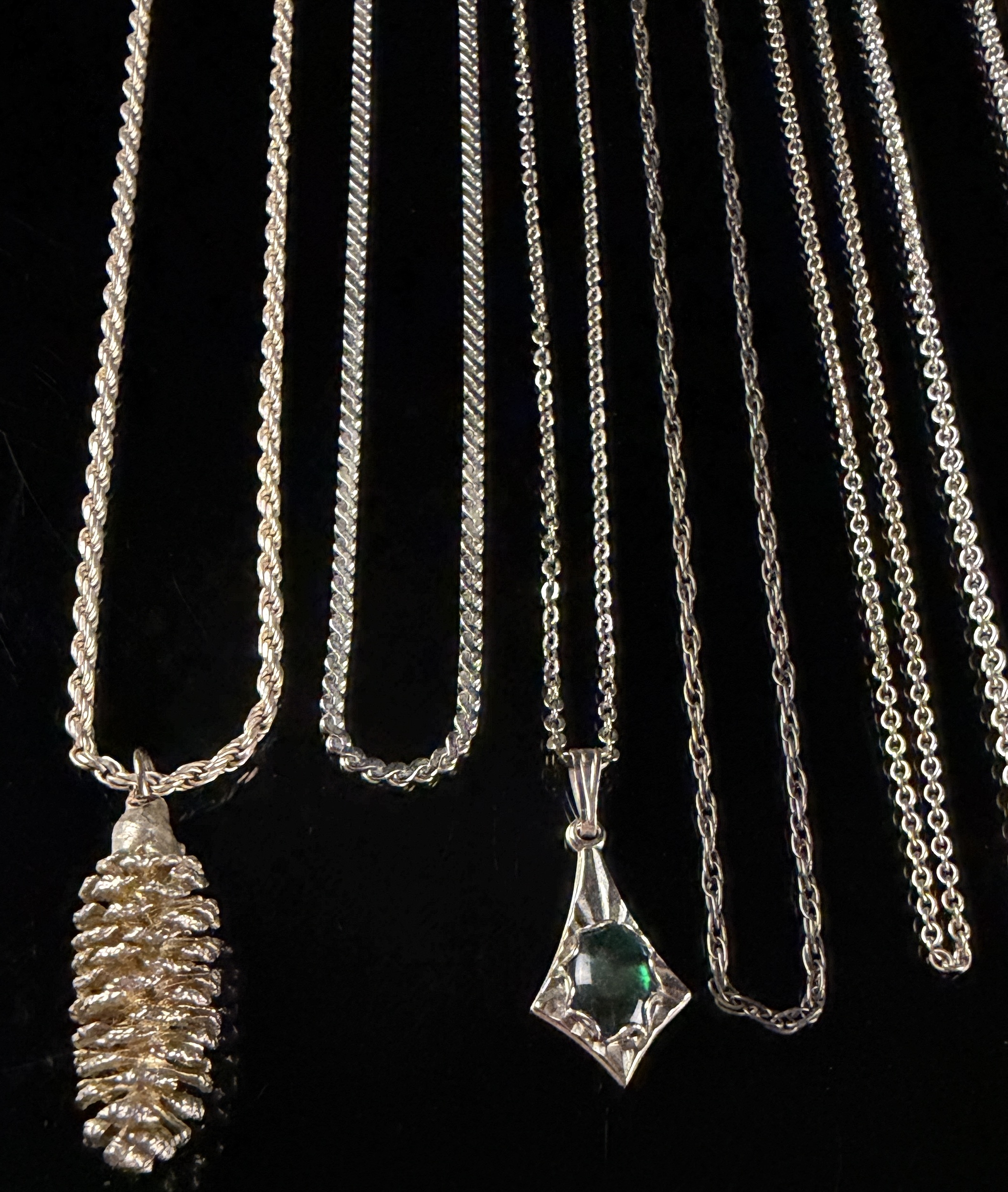 An Assortment of Eleven Sterling Silver Necklaces and Pendants