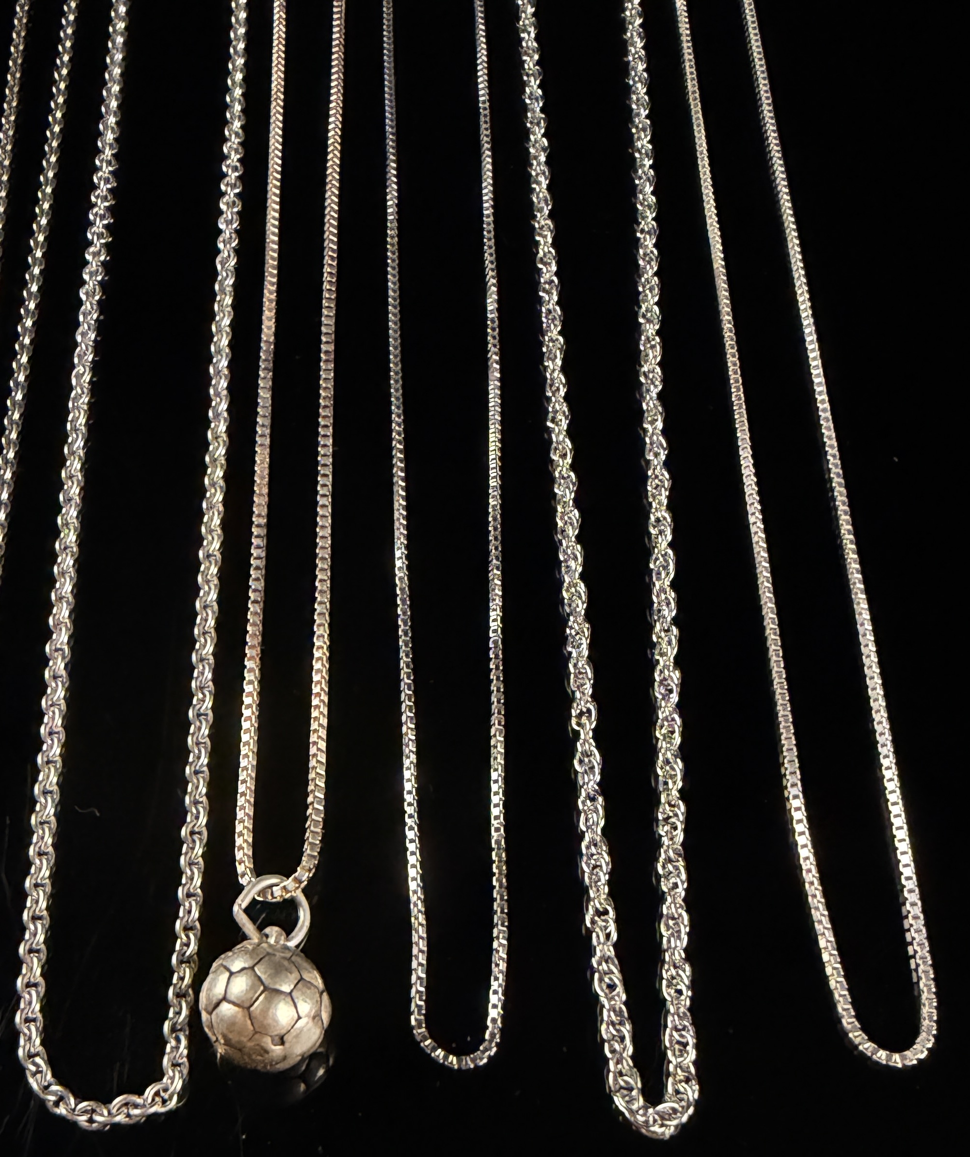 An Assortment of Eleven Sterling Silver Necklaces and Pendants