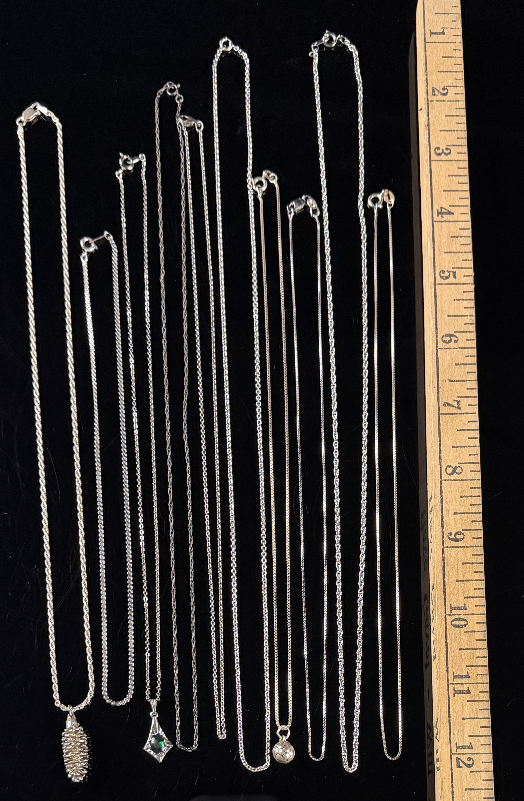 An Assortment of Eleven Sterling Silver Necklaces and Pendants