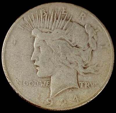 1924 US Peace Silver Dollar. 1924 US Peace silver dollar minted in Philadelphia. This coin is 