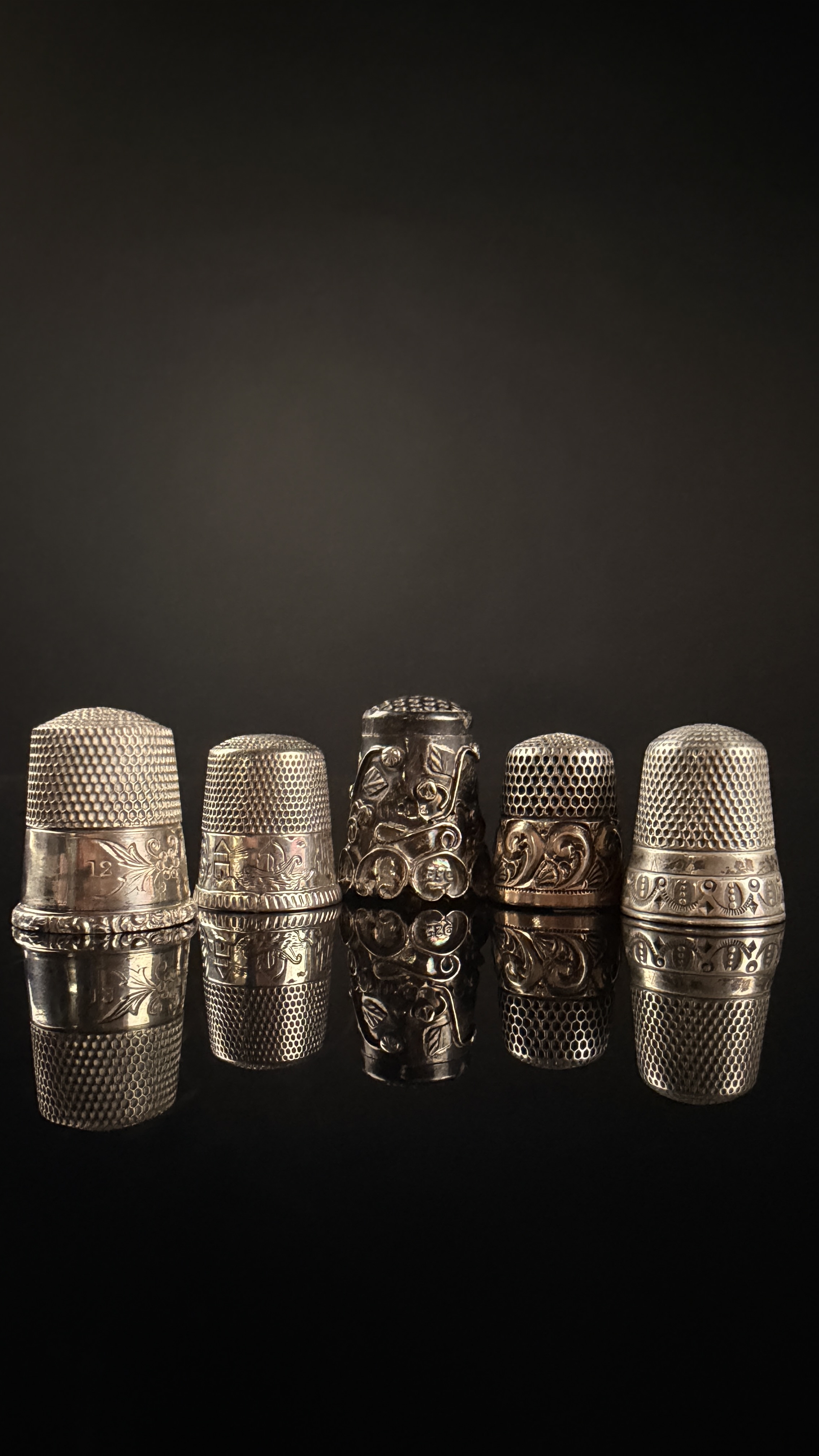 A Collection of Five Antique and Vintage Sterling Silver Thimbles