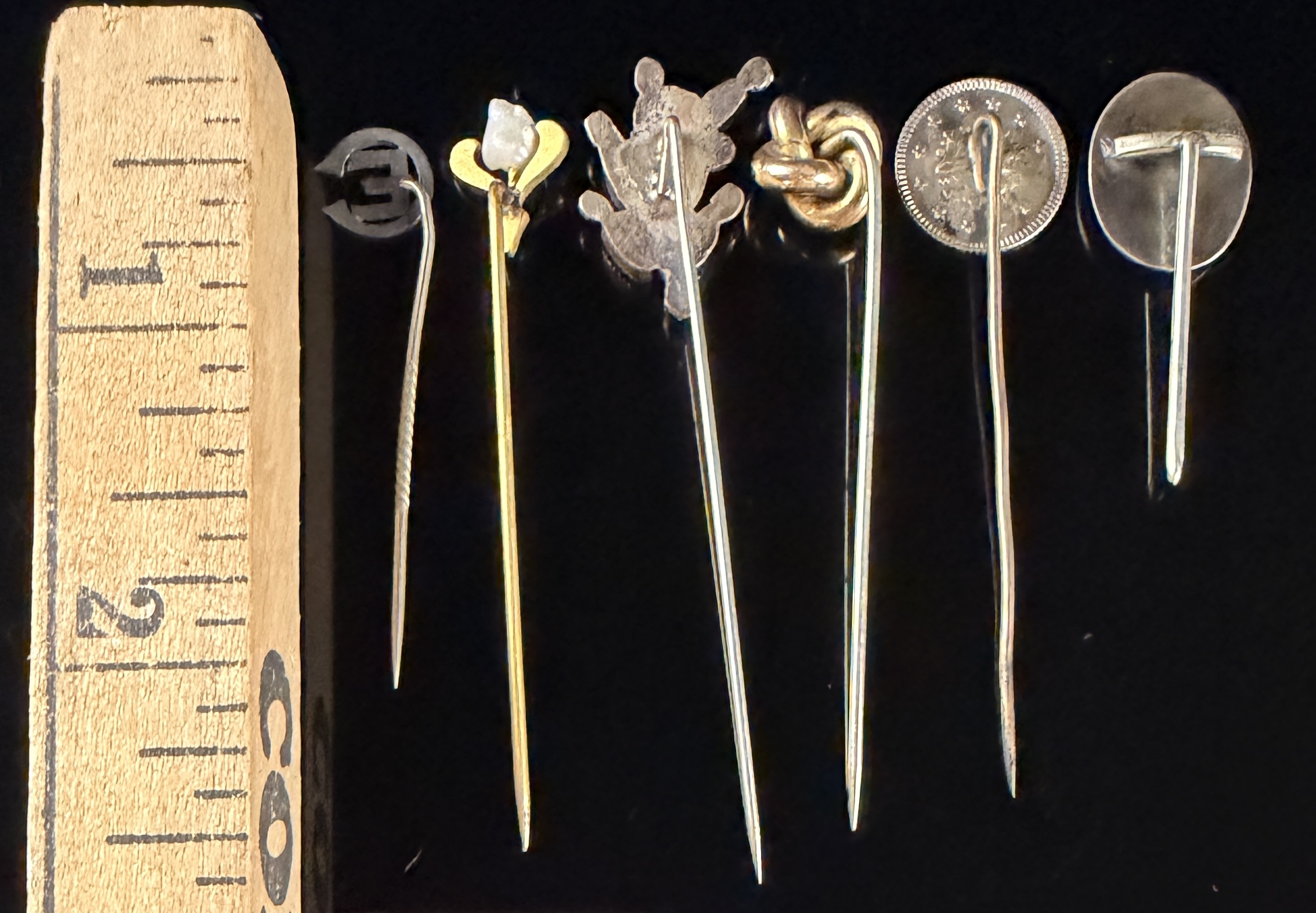 A Collection of Six Vintage and Antique Stick Pins
