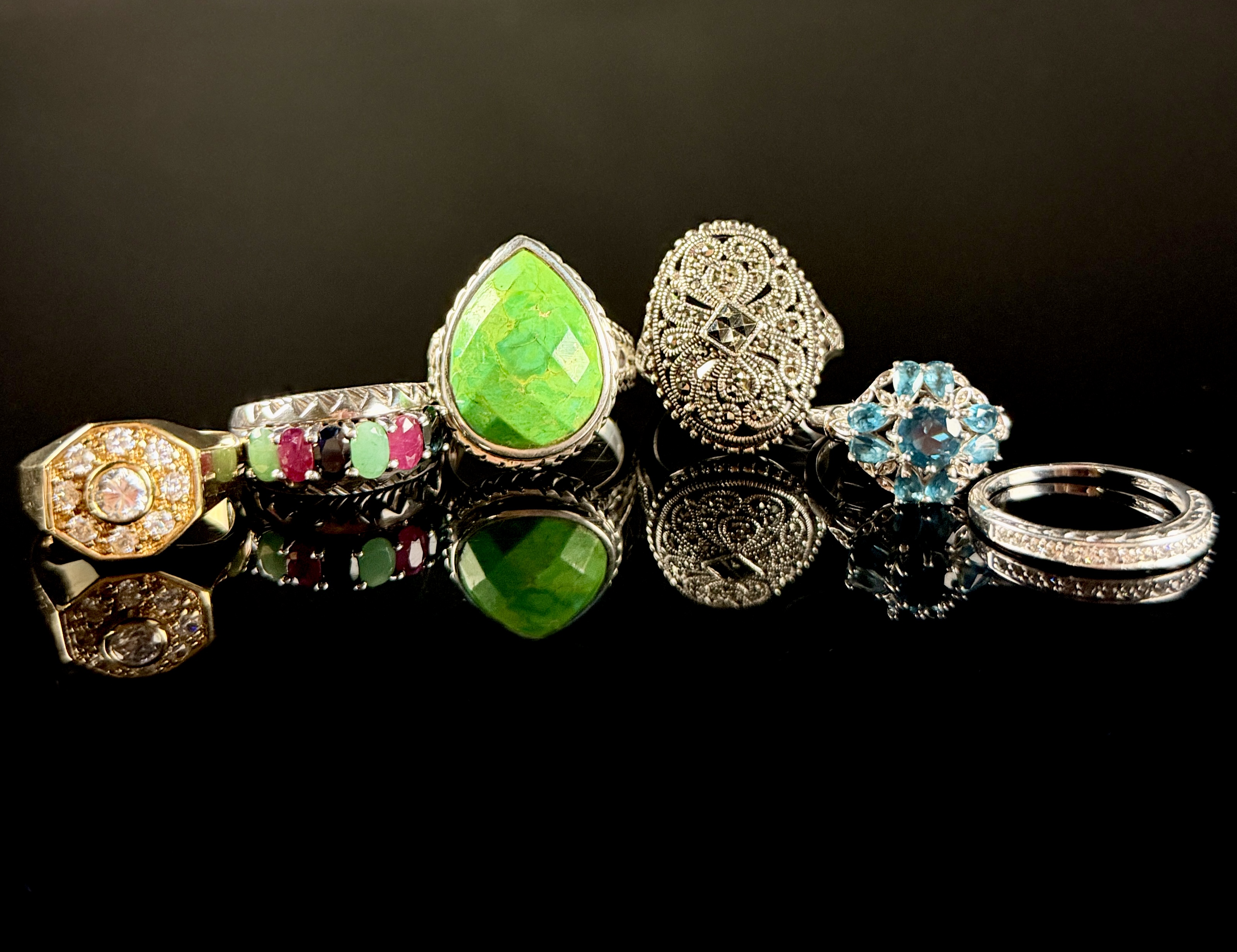 A Collection of Six Sterling Silver and Gemstone Rings