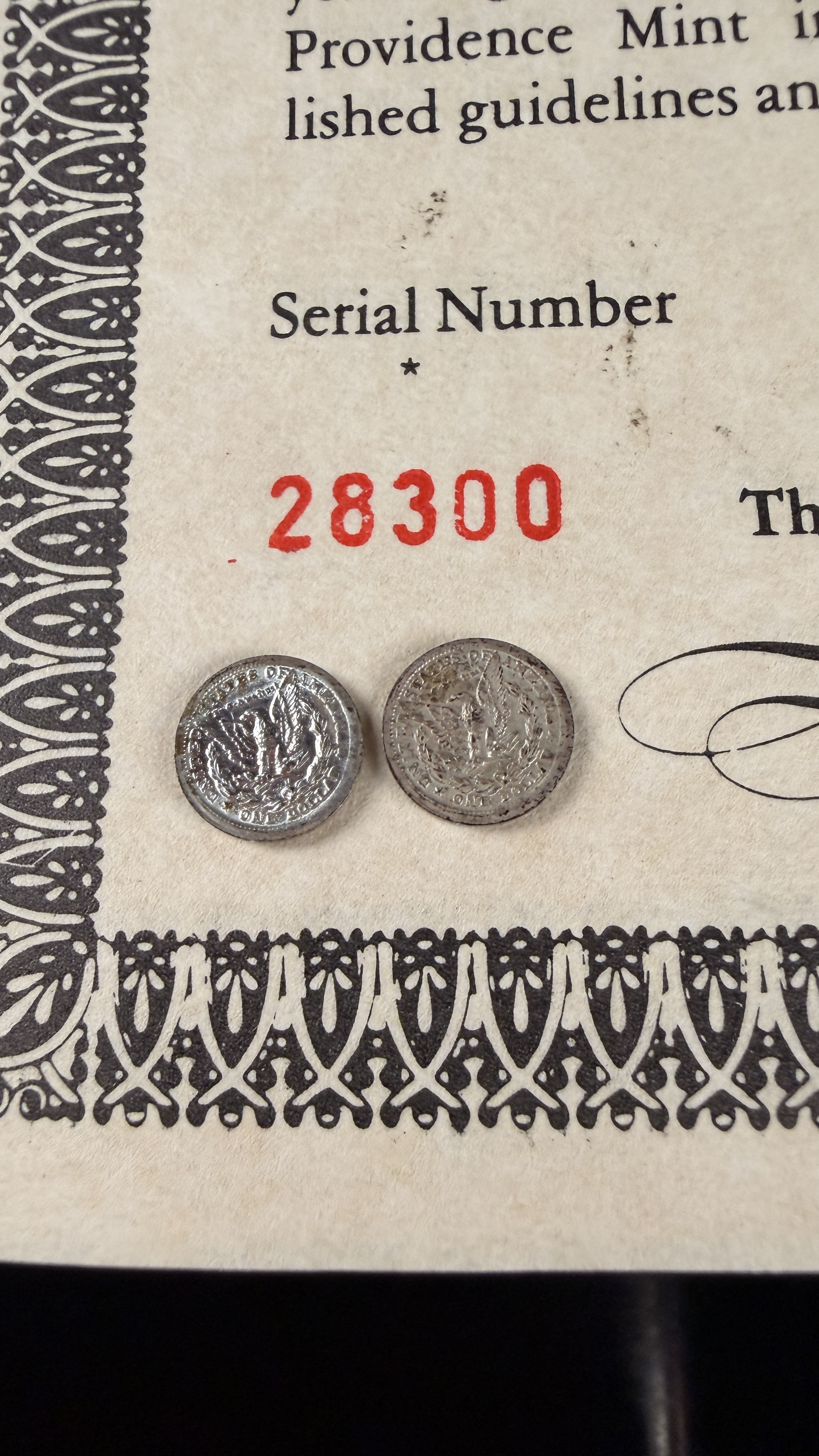 A Pair of US Historic Providence Mint Miniature Sterling Silver Morgan Dollars