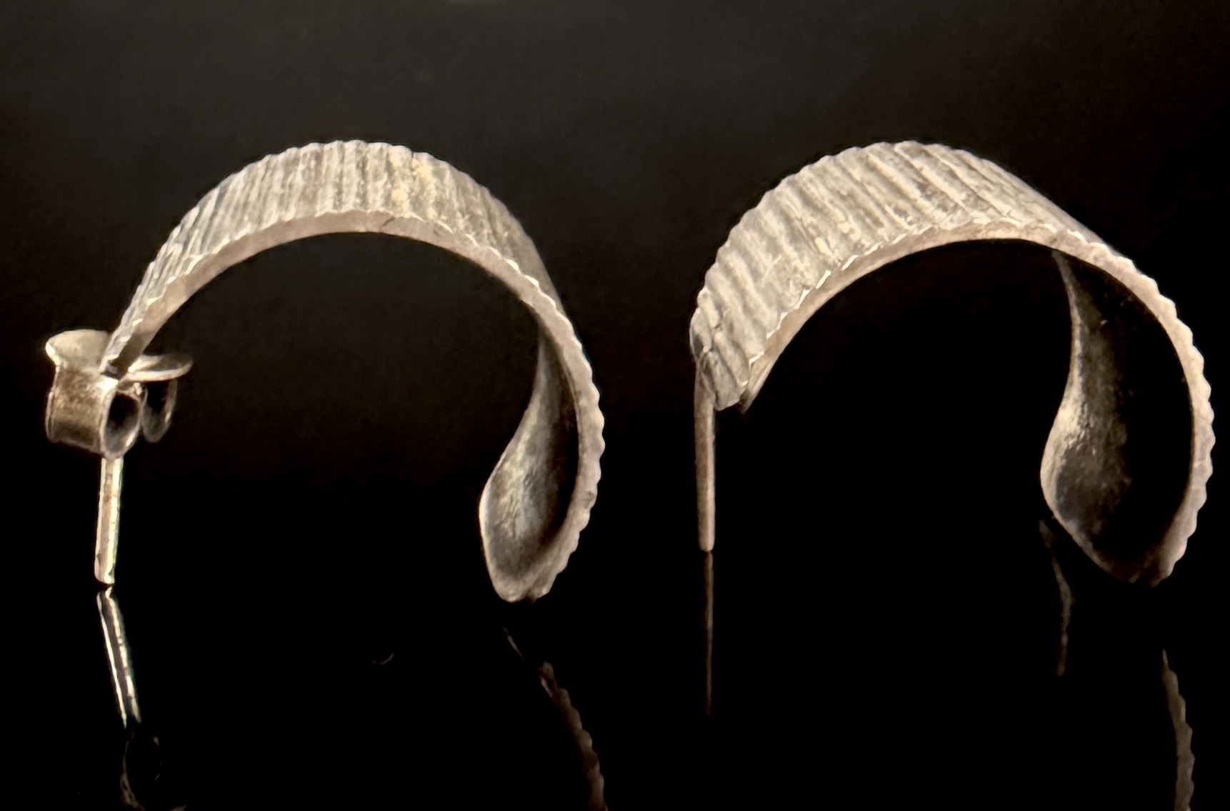 A Pair of Mexican Sterling Silver Textured Half-Hoop Earrings and an Abalone Shell Bracelet