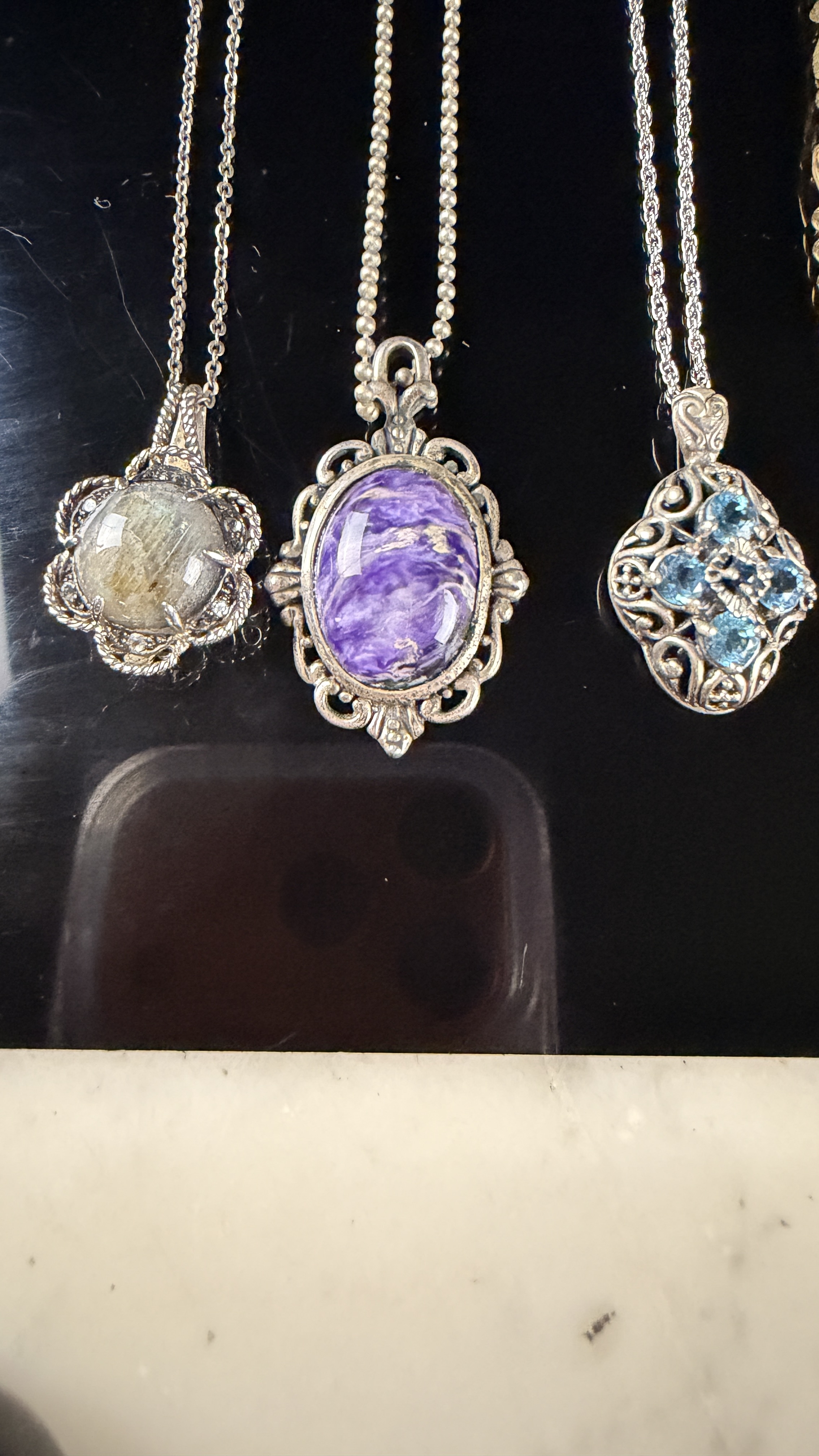 A Collection of eleven sterling silver necklaces and gemstone pendants