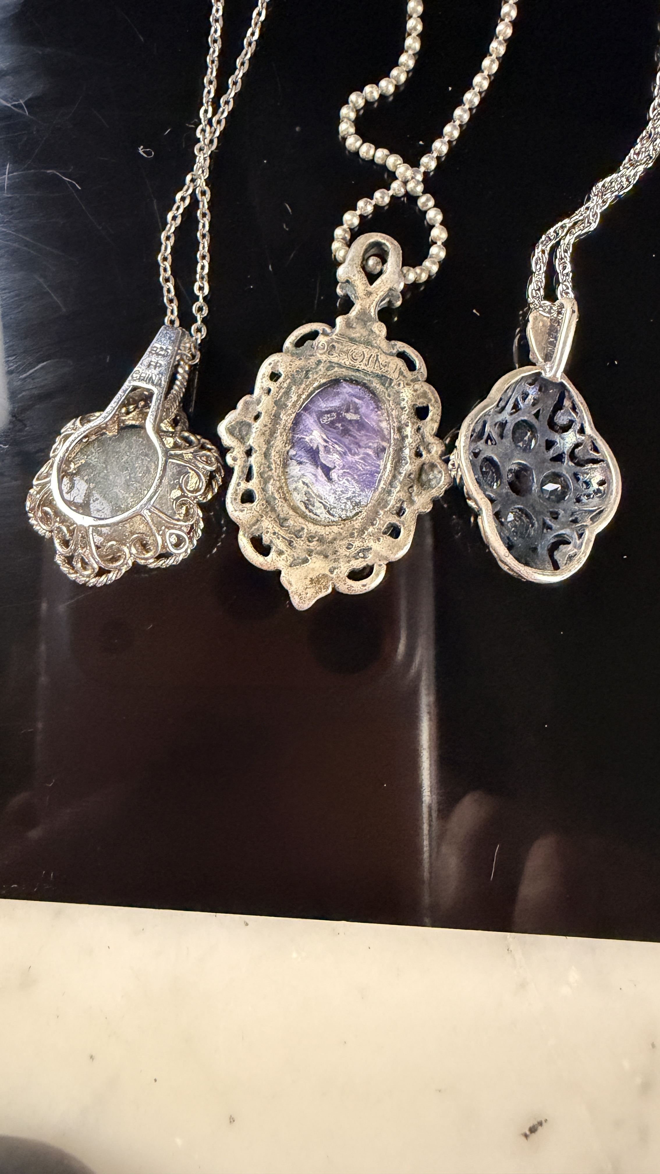 A Collection of eleven sterling silver necklaces and gemstone pendants