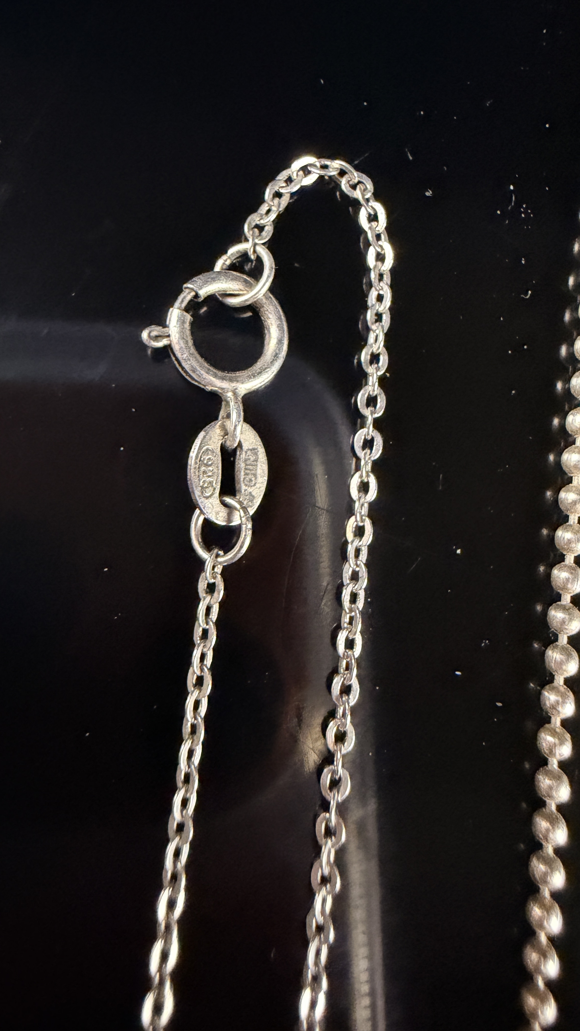 A Collection of eleven sterling silver necklaces and gemstone pendants