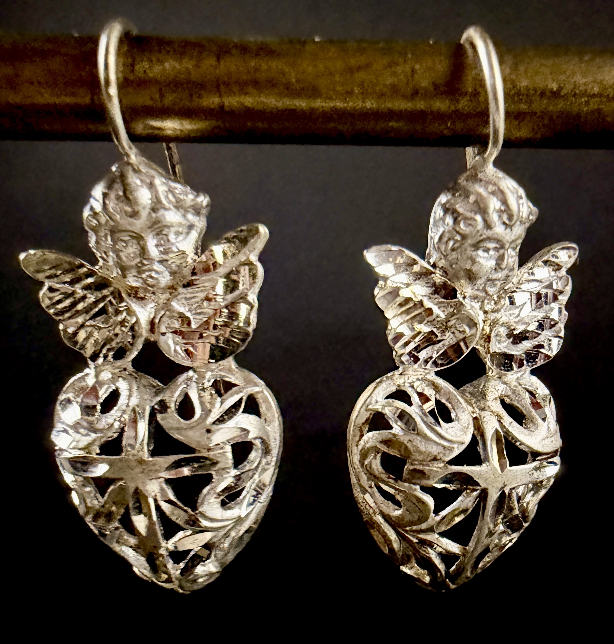 A Pair of Sterling Silver Cherub and Filigree Heart Drop Earrings
