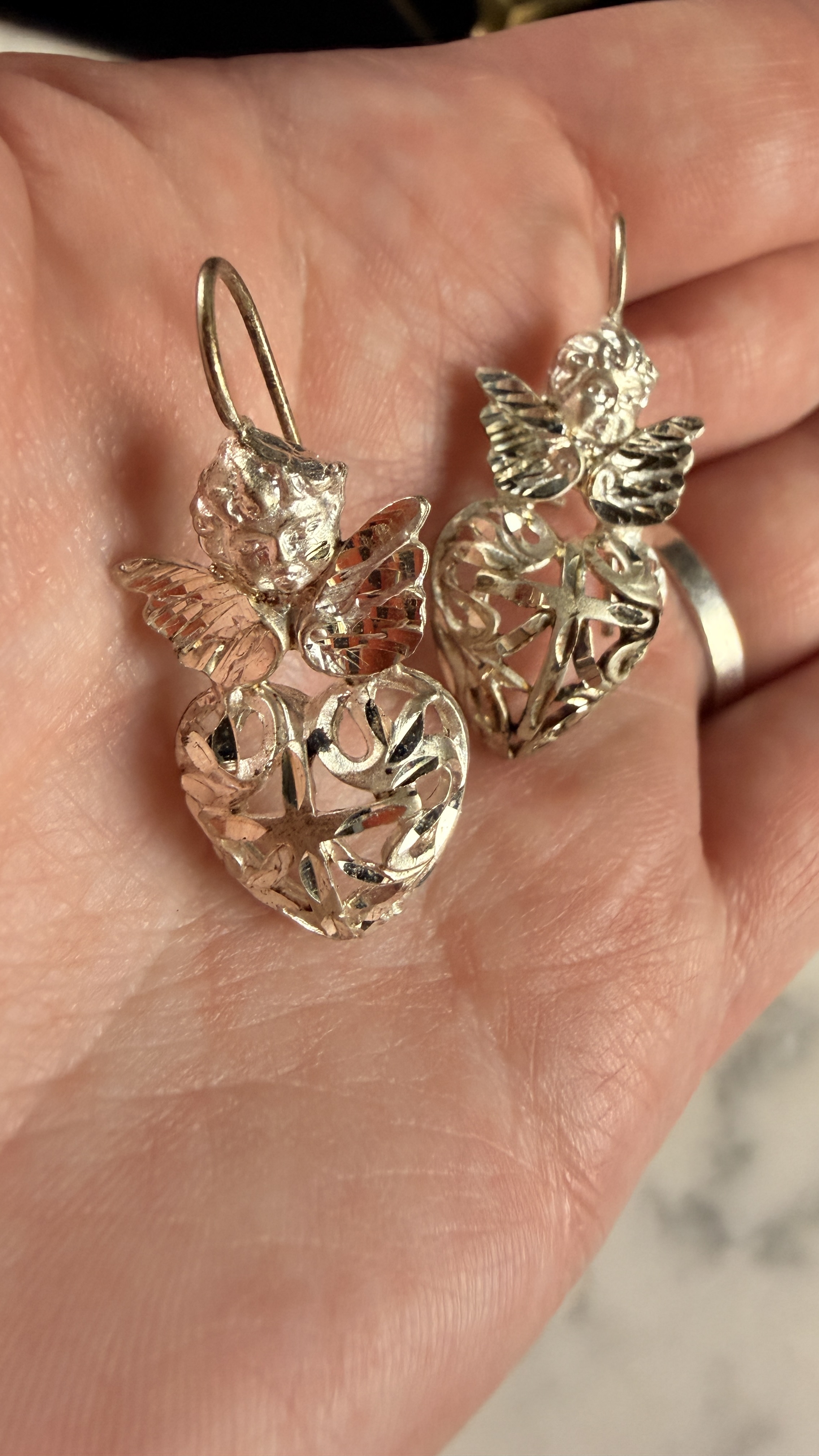 A Pair of Sterling Silver Cherub and Filigree Heart Drop Earrings
