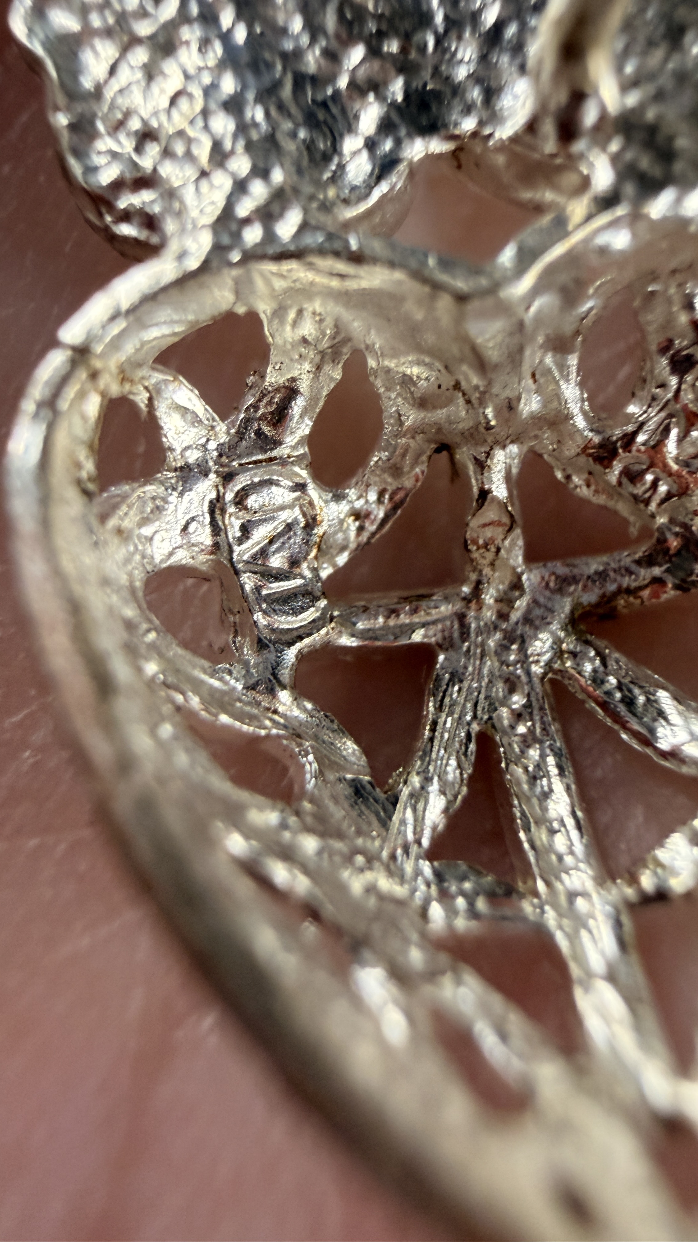 A Pair of Sterling Silver Cherub and Filigree Heart Drop Earrings