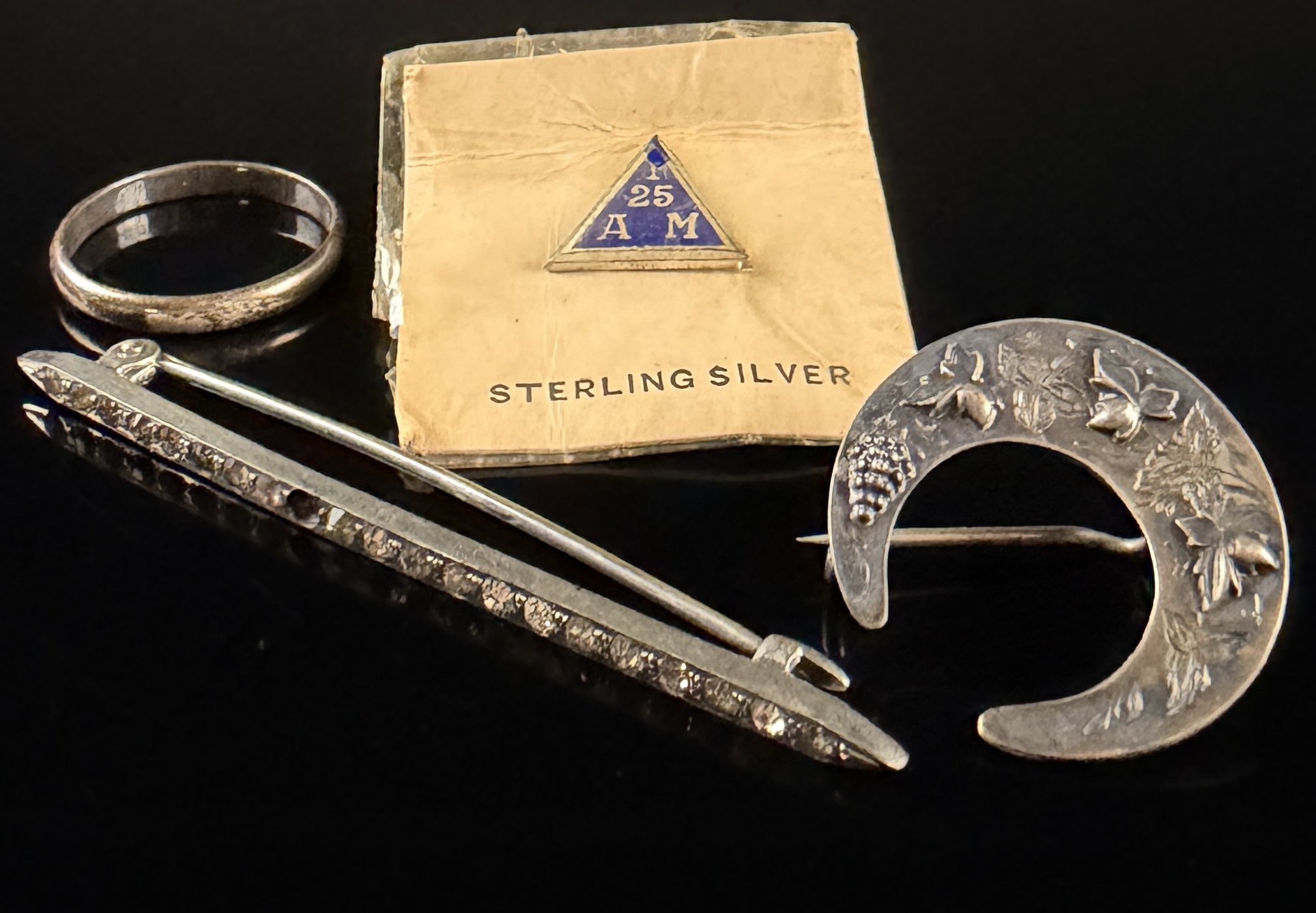 A Collection of Sterling Silver Jewelry including a Hallmarked Crescent Brooch and Uncas Ring