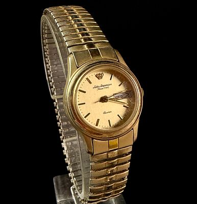Jules Jurgensen Ladies Gold Tone Quartz Day Date Wristwatch Reference 3248. A vintage Jules 