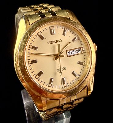 Vintage Seiko SQ 50 Gold-Tone Quartz Wristwatch Ref. 7N43-8A00. This vintage Seiko SQ 50 quartz 