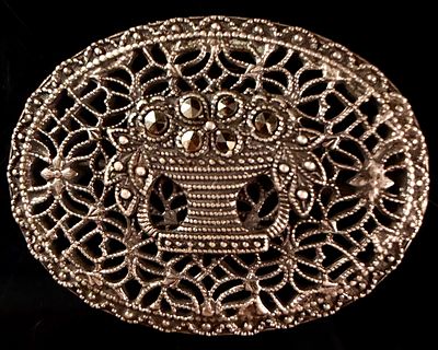 Sterling Silver Marcasite Flower Basket Openwork Brooch. An oval sterling silver brooch 