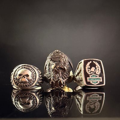 A Trio of Harley-Davidson Sterling Silver Rings. A collection of three sterling silver rings 
