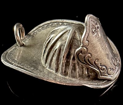 Presumably Sterling Silver Firefighter Helmet Pendant. A three-dimensional miniature firefighter 