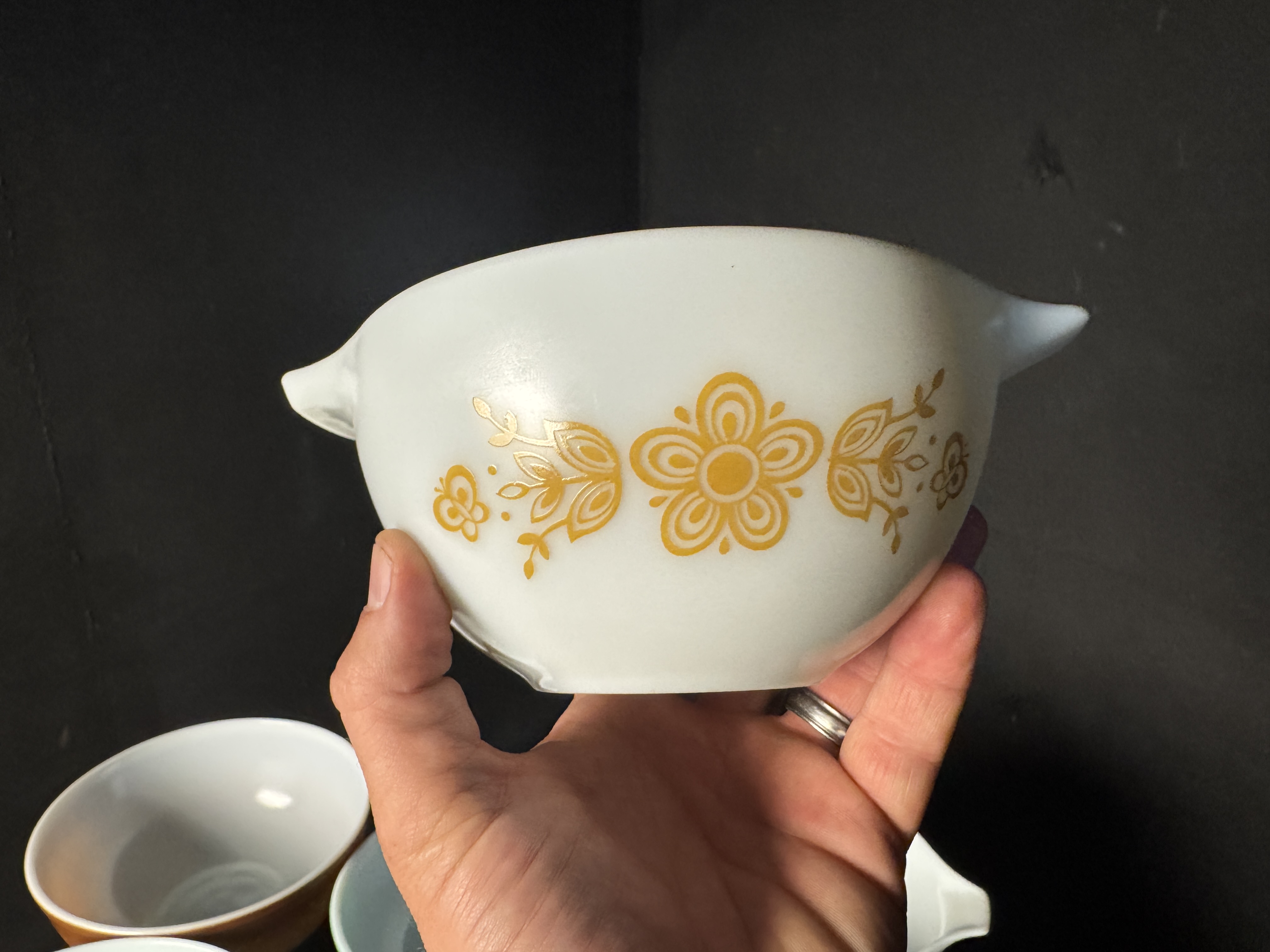 Nine Piece Collection of Vintage Pyrex Opal Glass Bowls in Friendship, Butterprint, and Butterfly Gold Patterns