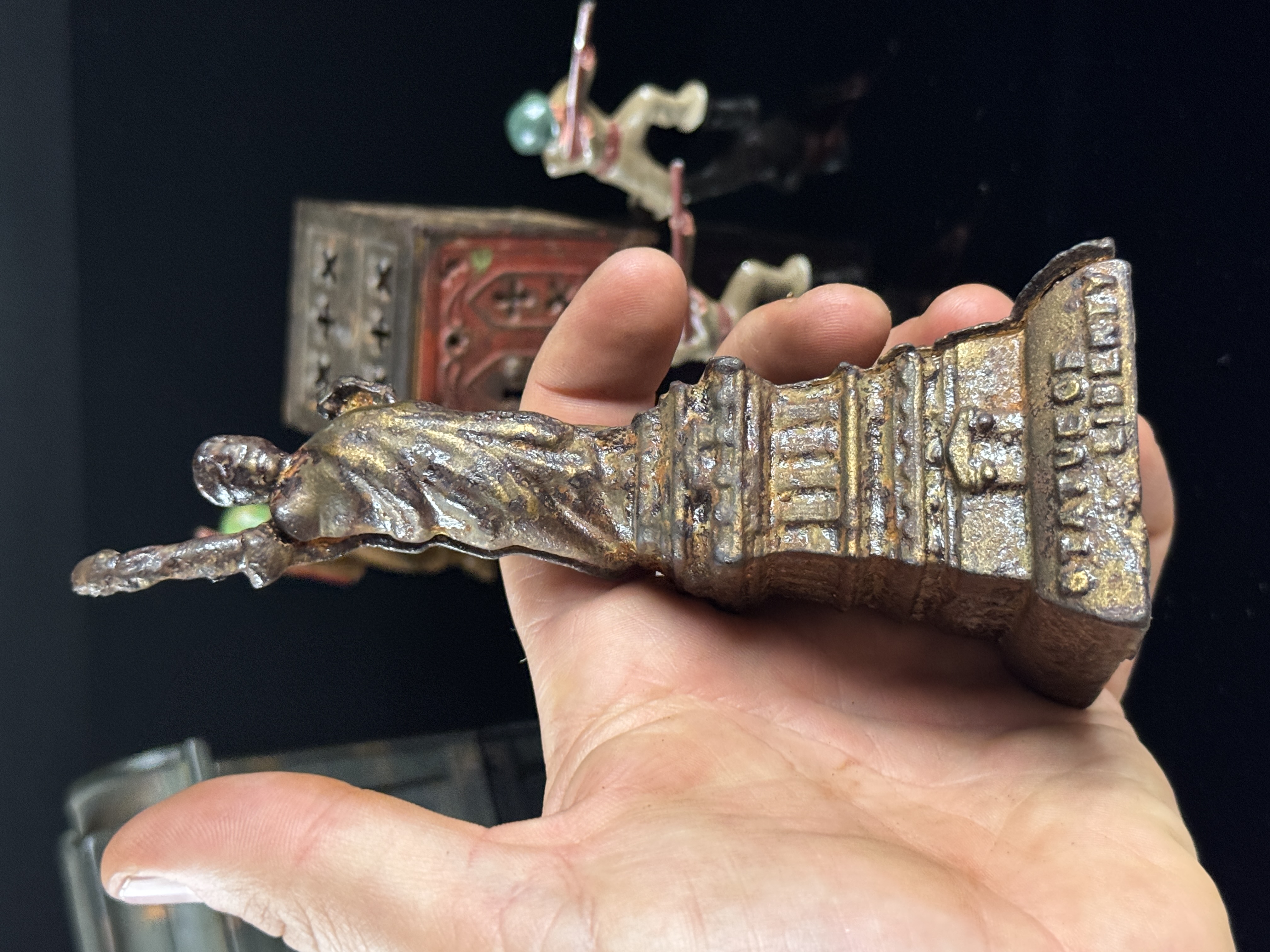 A Collection of Vintage Cast Metal Savings Banks and Military Figures