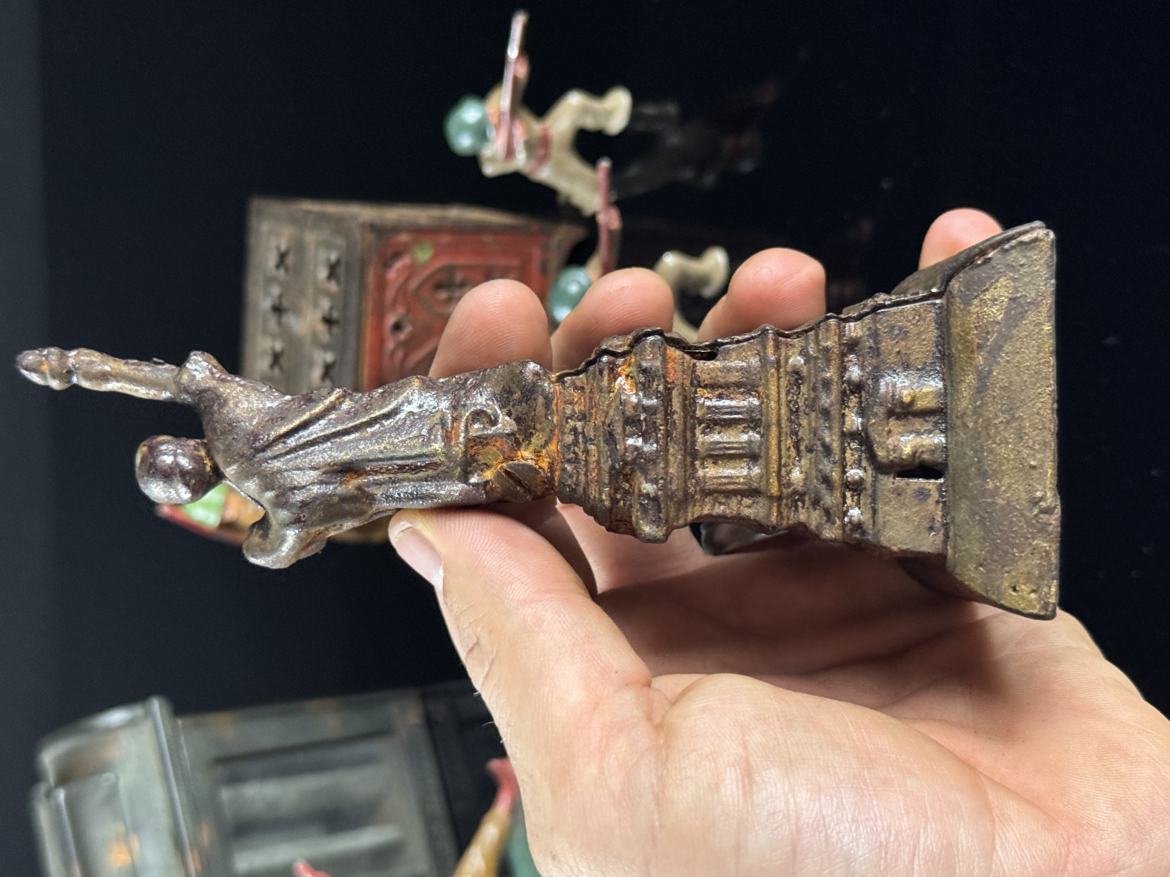 A Collection of Vintage Cast Metal Savings Banks and Military Figures