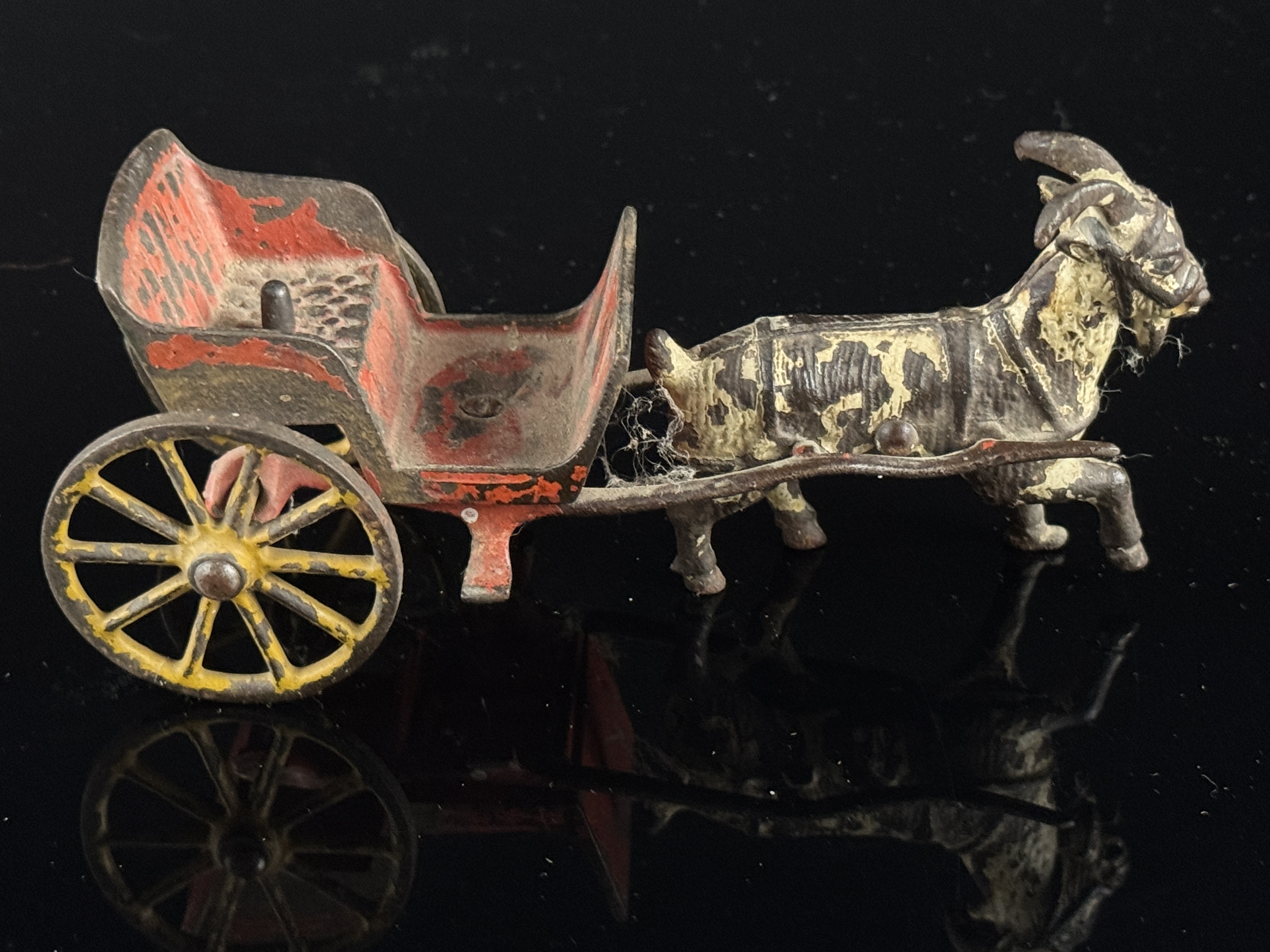 A Collection of Antique Cast Iron Animal-Drawn Toys and a Hall's Excelsior Mechanical Bank