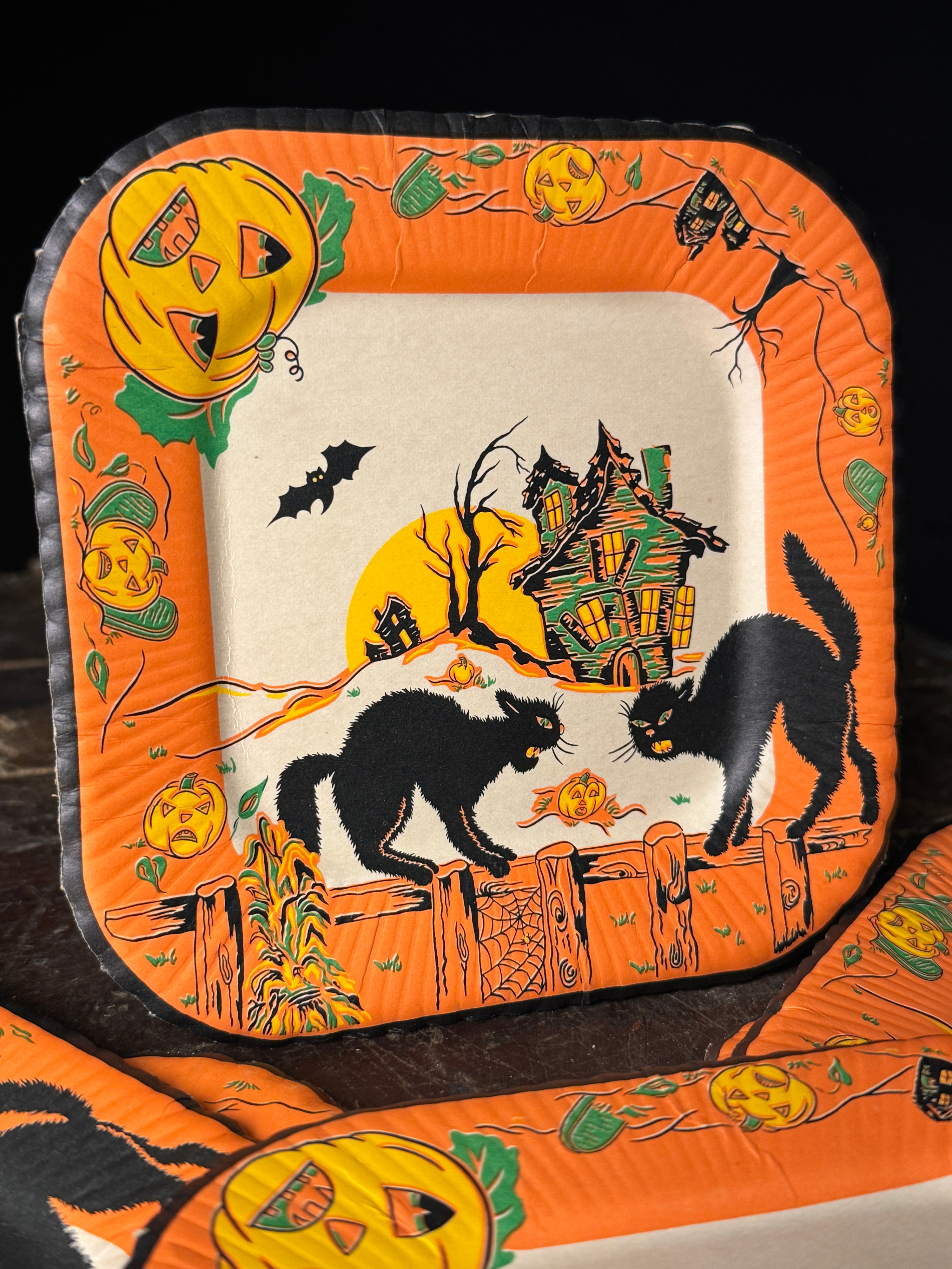 A Set of Six Vintage Halloween Square Paper Plates with Black Cat and Haunted House Motifs